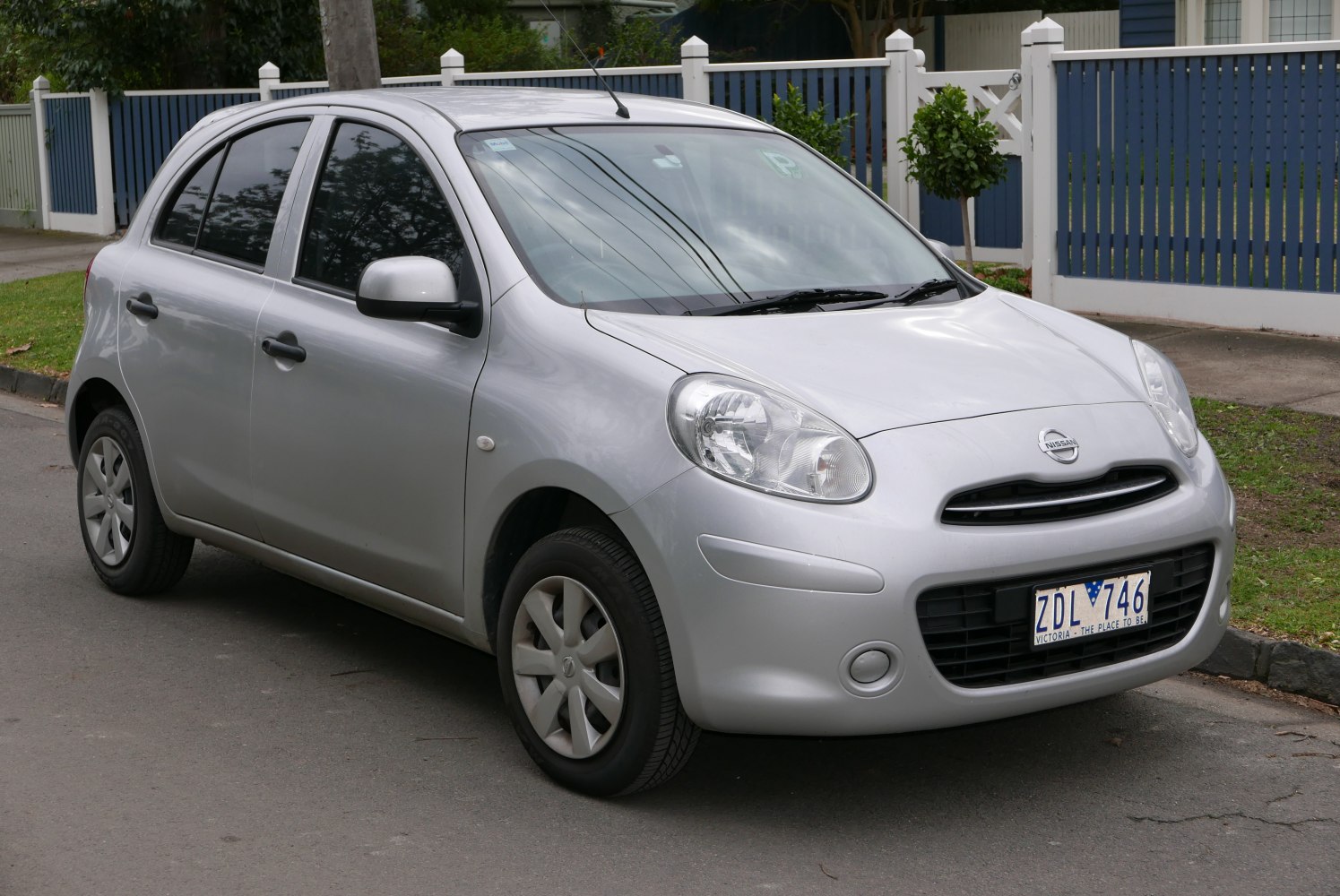 Compact hatchback with rounded headlights and aerodynamic body shape