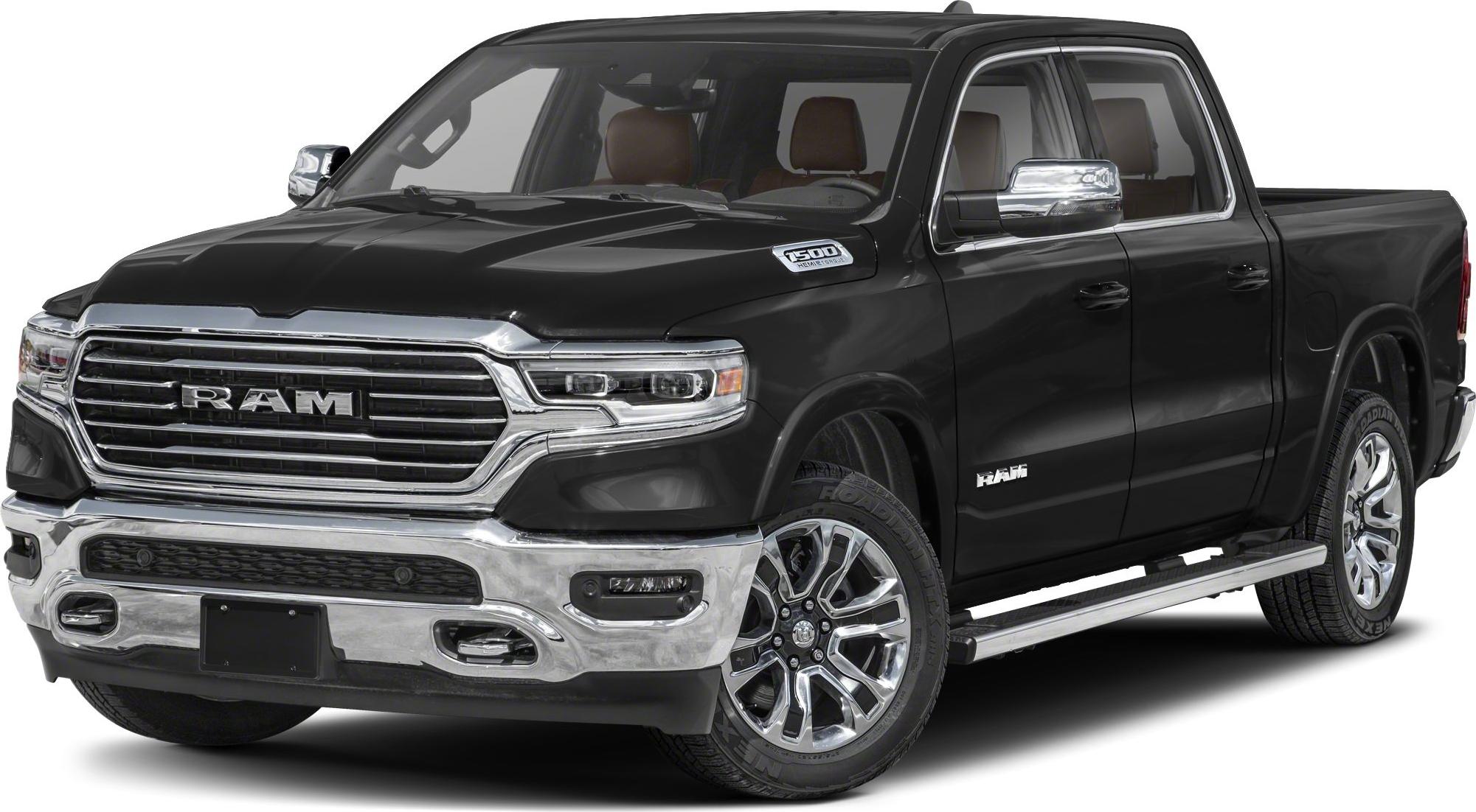 Chrome grille and alloy wheels on a black pickup truck.