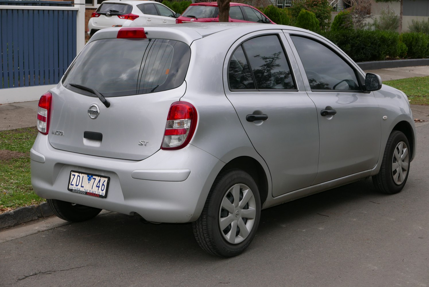 Rear and side view of silver hatchback with compact design