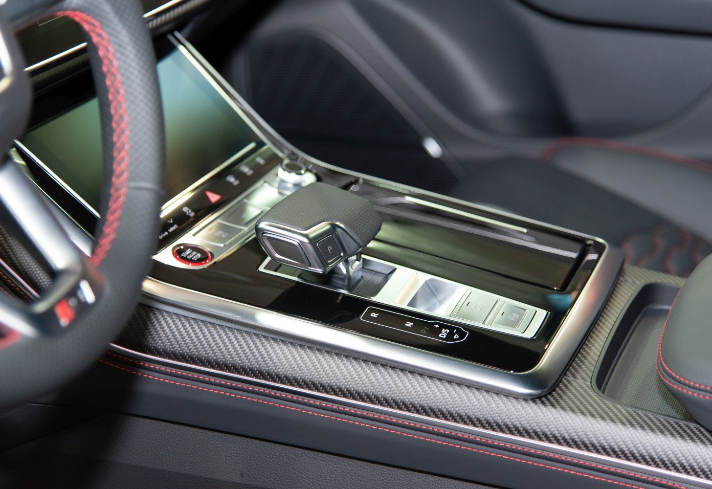 Gear shift lever and center console with carbon fiber and red stitching