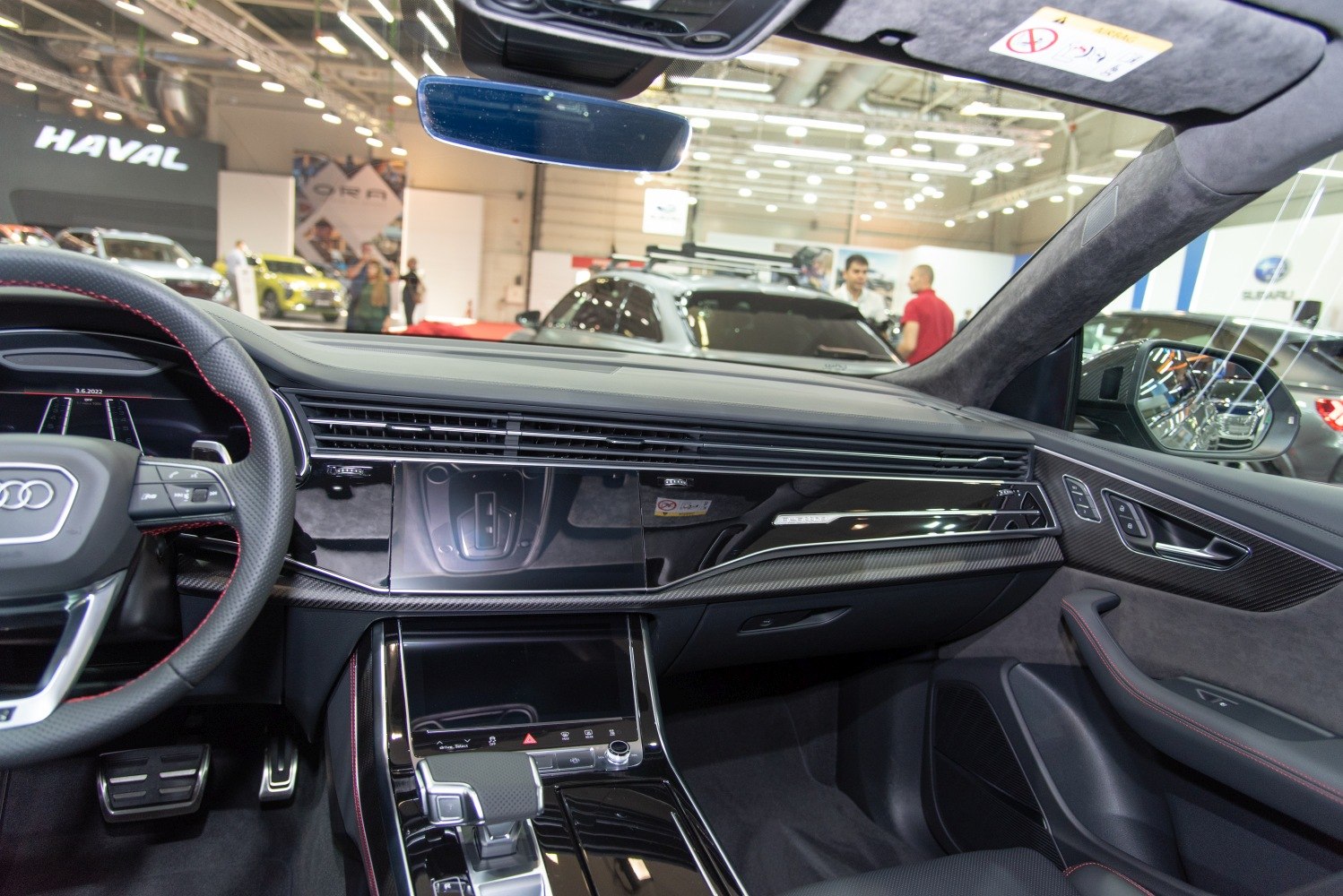 Modern Audi SUV interior with digital dashboard and glossy center console