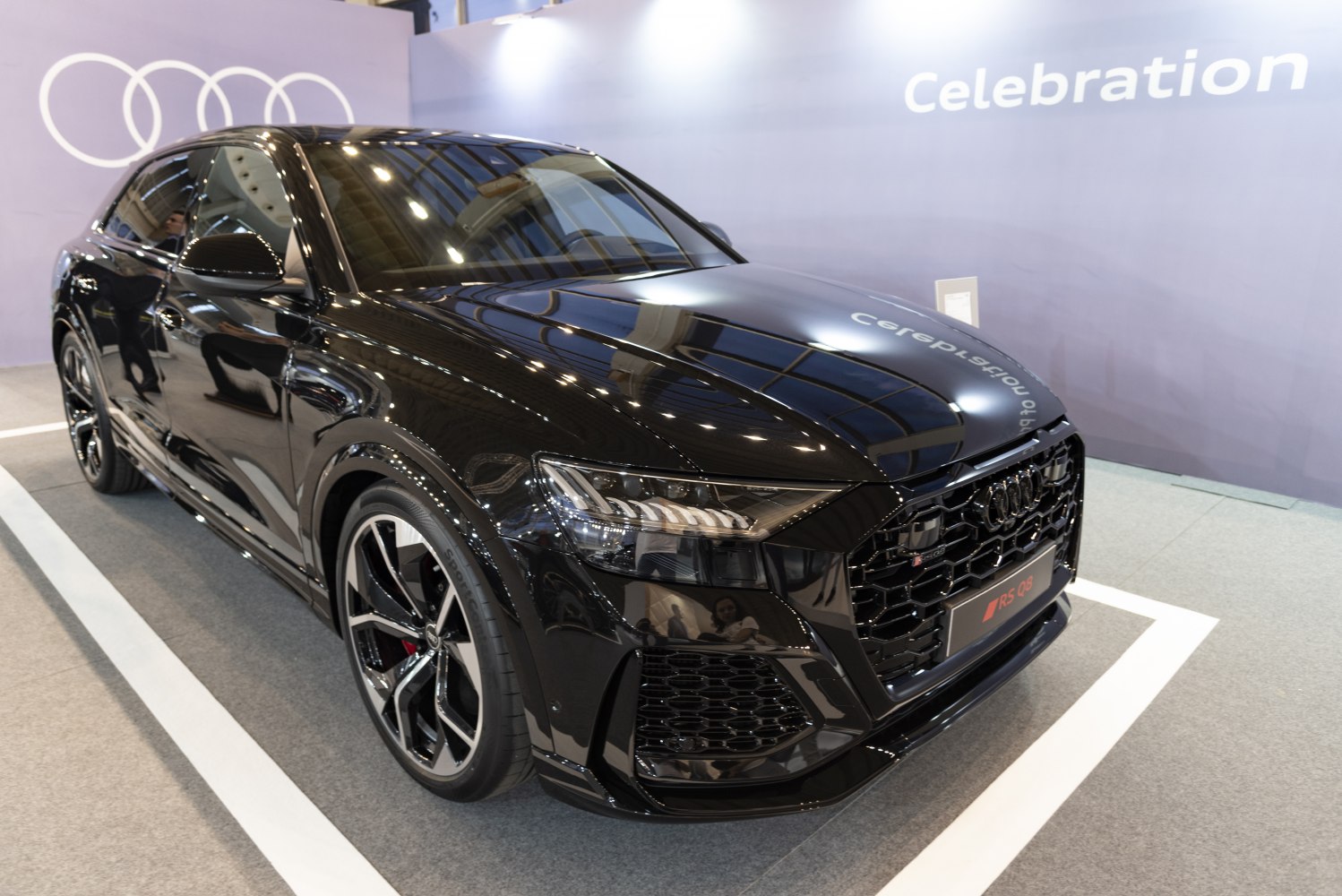 Black luxury SUV with aggressive front grille and sporty alloy wheels