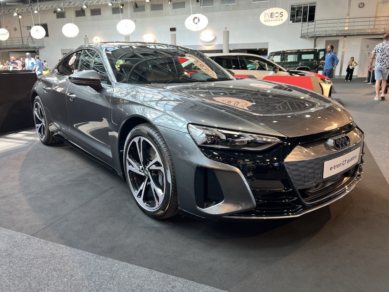 Electric sedan front and side view with LED headlights and alloy wheels