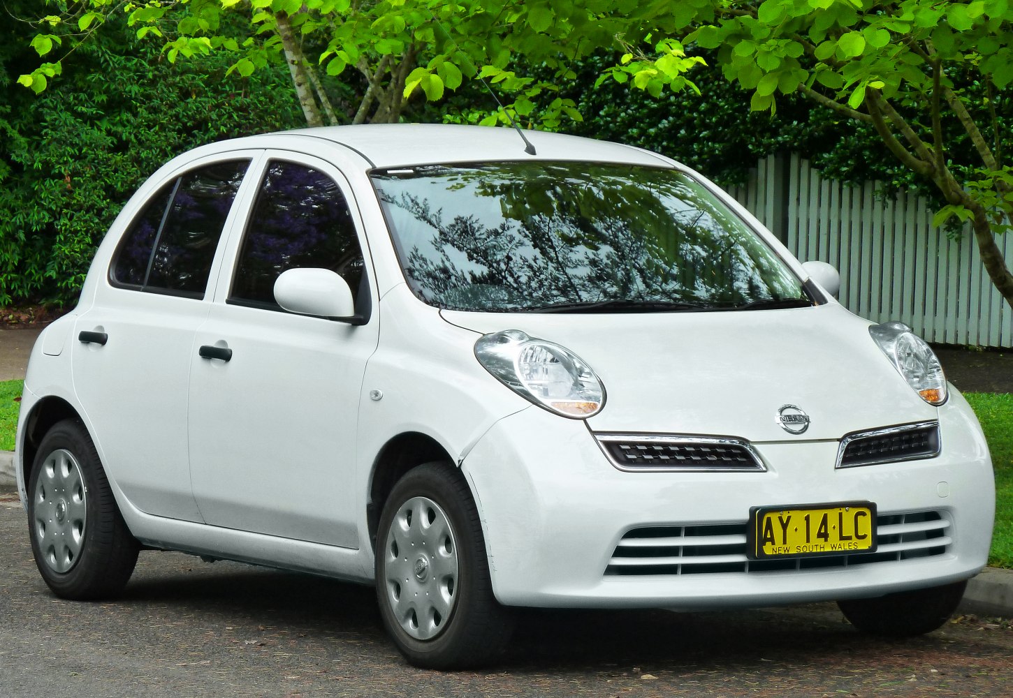 Compact hatchback with rounded headlights and smooth front grille