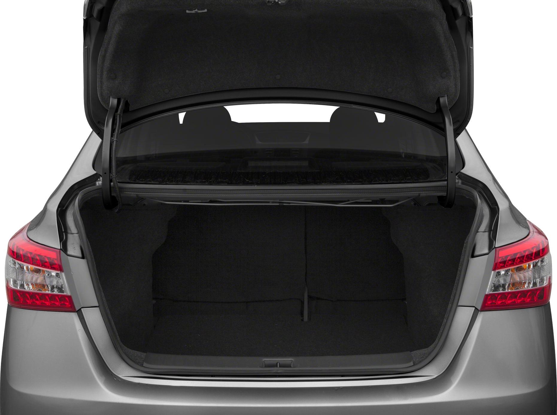 Open sedan trunk showcasing spacious rear storage area and taillights.
