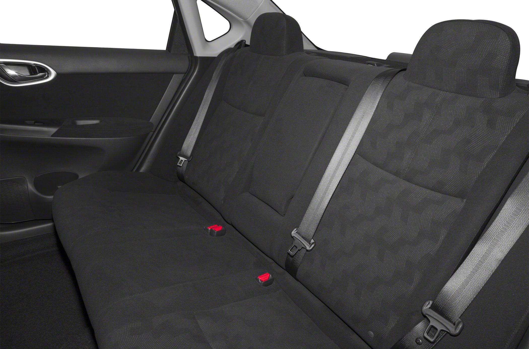 Rear seat interior with black fabric upholstery, seat belts, and headrests.