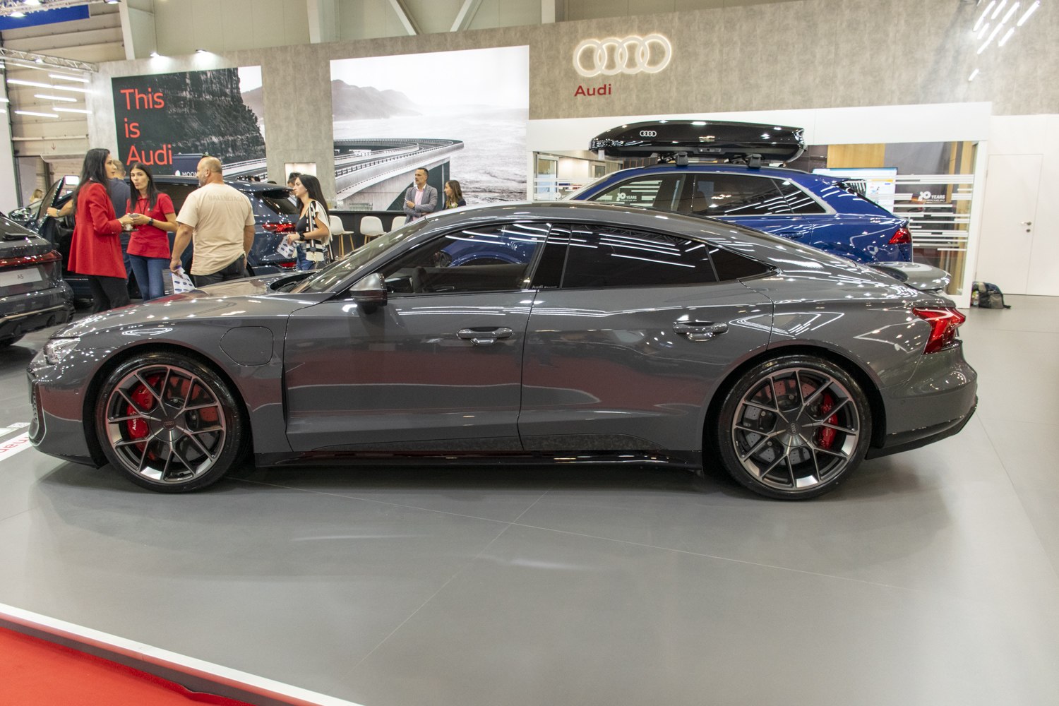 Sleek side profile with sporty multi-spoke wheels and red brake calipers