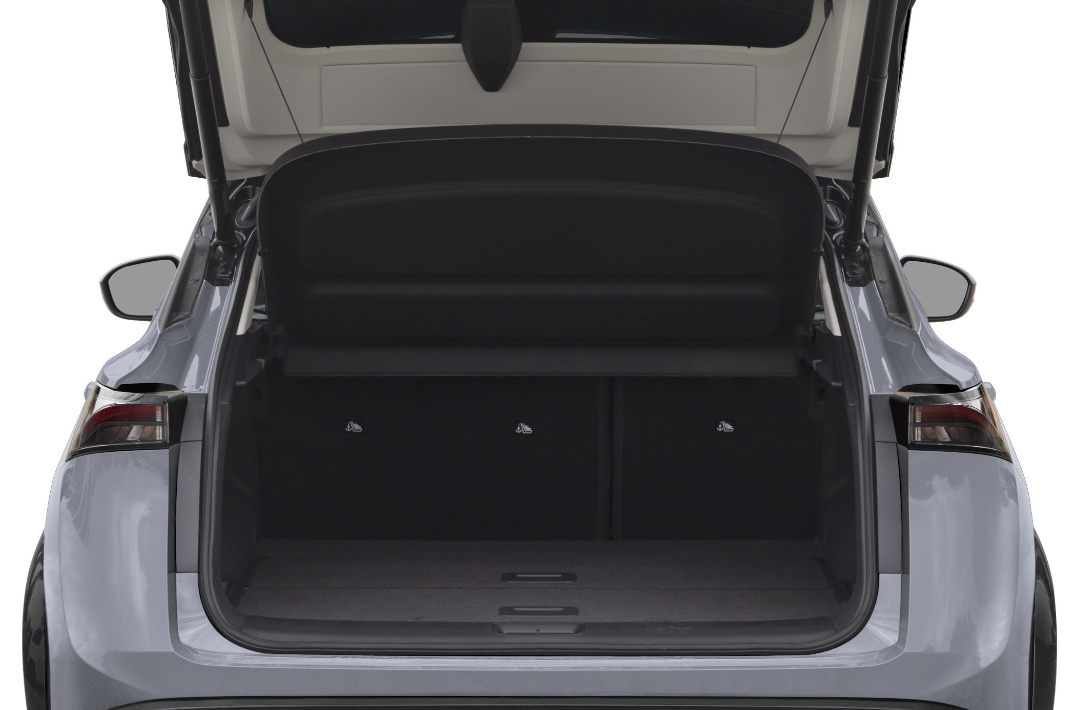 Spacious open trunk of an electric SUV with visible rear seats and hatch open