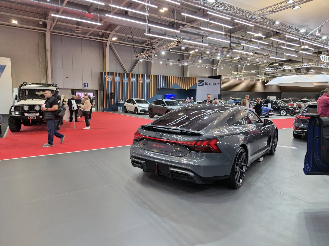 Rear view of sporty electric sedan with sleek taillights and diffuser