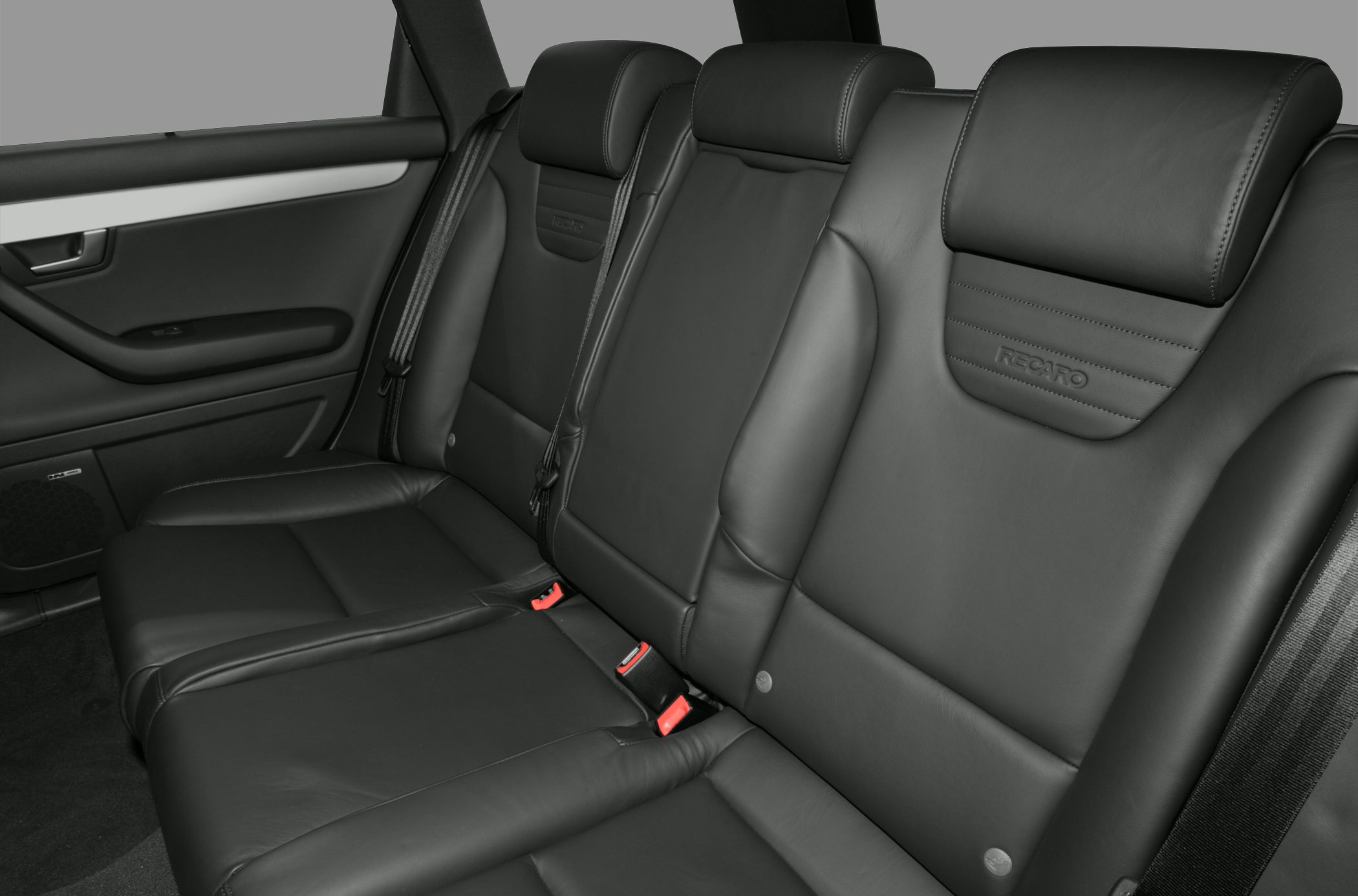 Rear leather seats with integrated headrests and Recaro branding