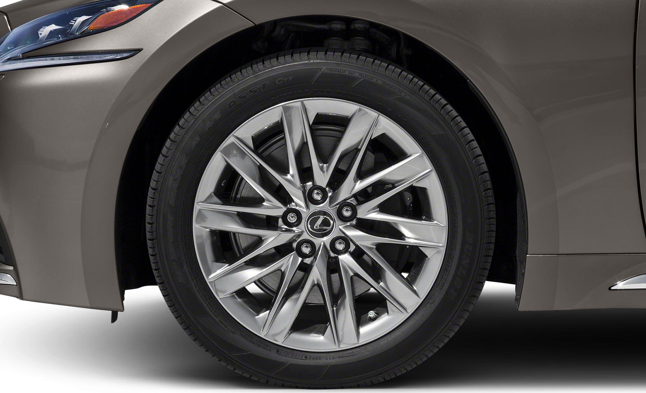 Multi-spoke alloy wheel with intricate design on luxury sedan
