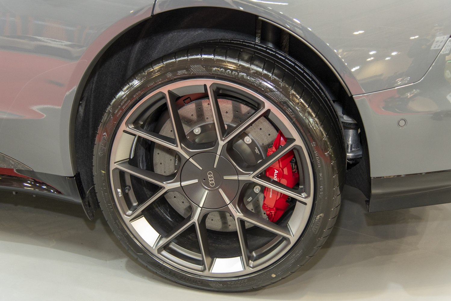 Multi-spoke alloy wheel with red performance brake caliper