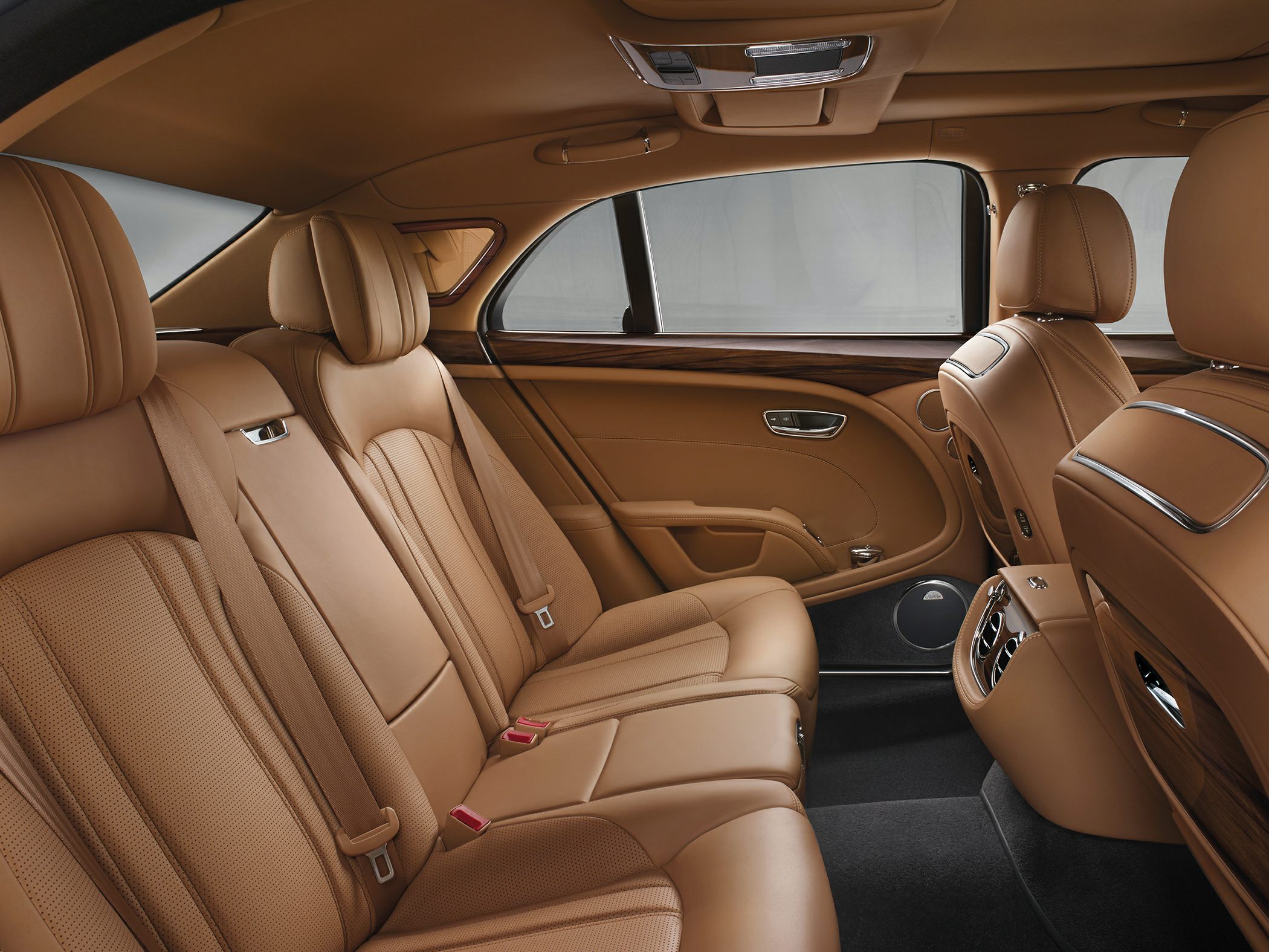 Luxury rear interior with premium leather seats and wood trim