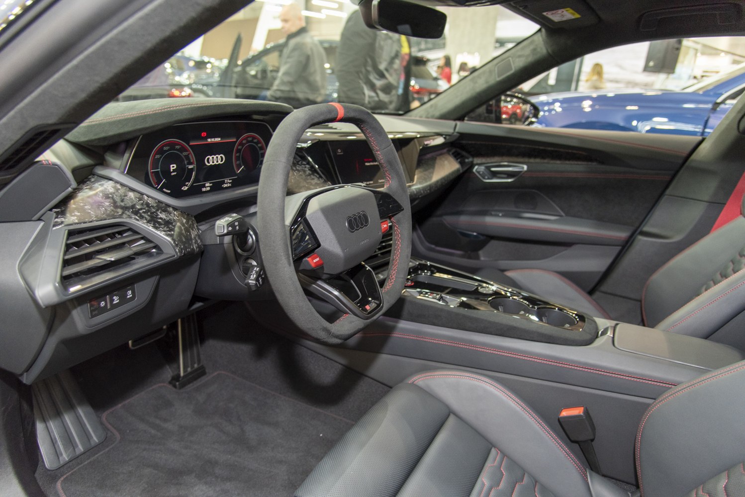 Digital cockpit and sport steering wheel with red stitching