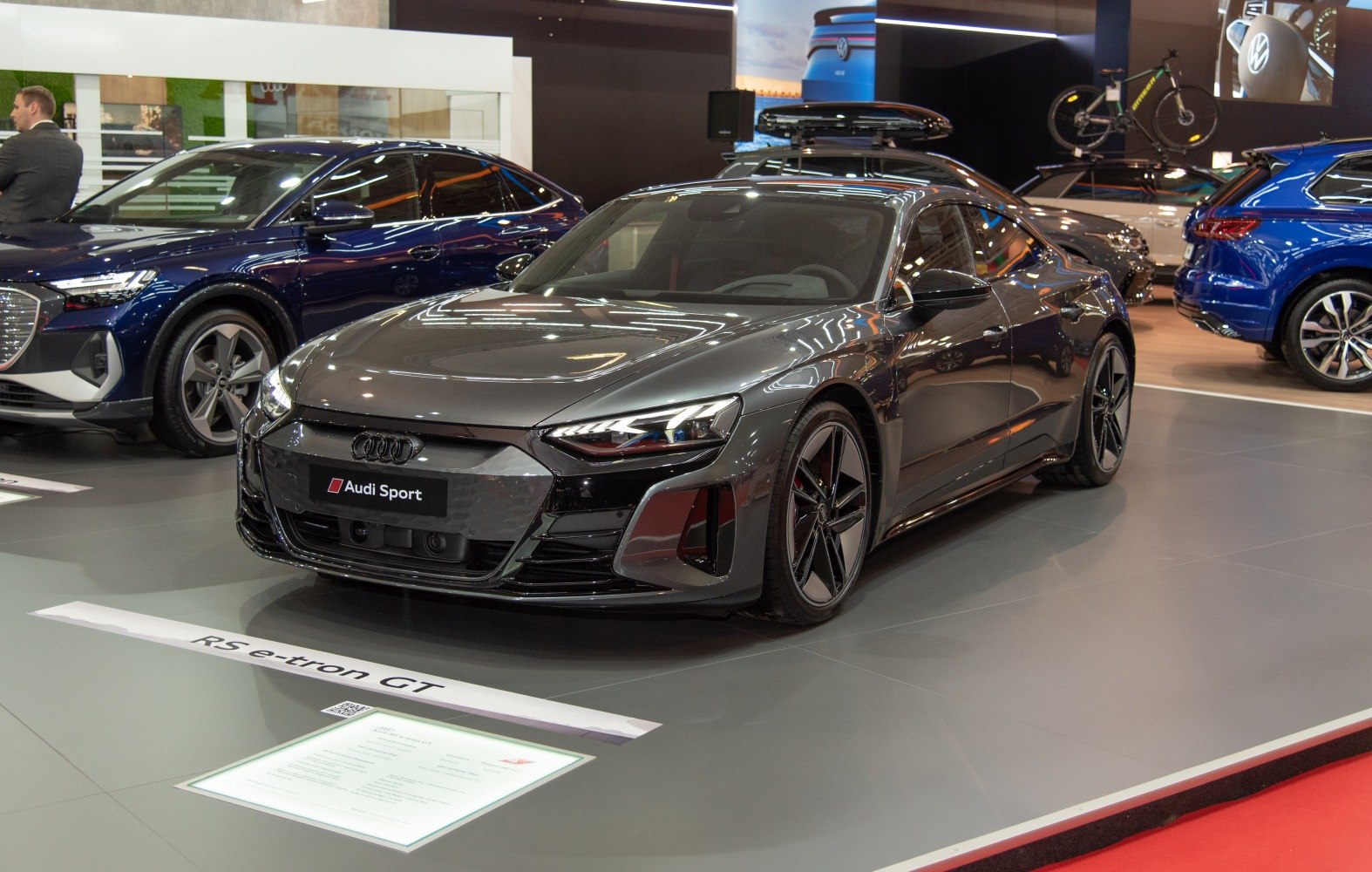 Front angled view of electric sports sedan with LED headlights and aerodynamic design