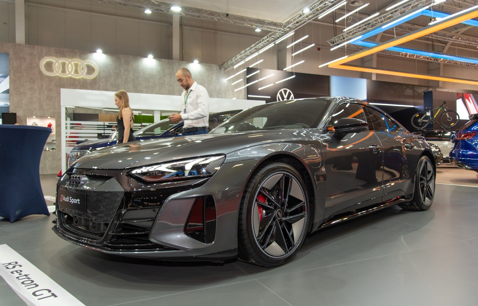 Front profile of an electric sports sedan with aerodynamic body and sporty wheels