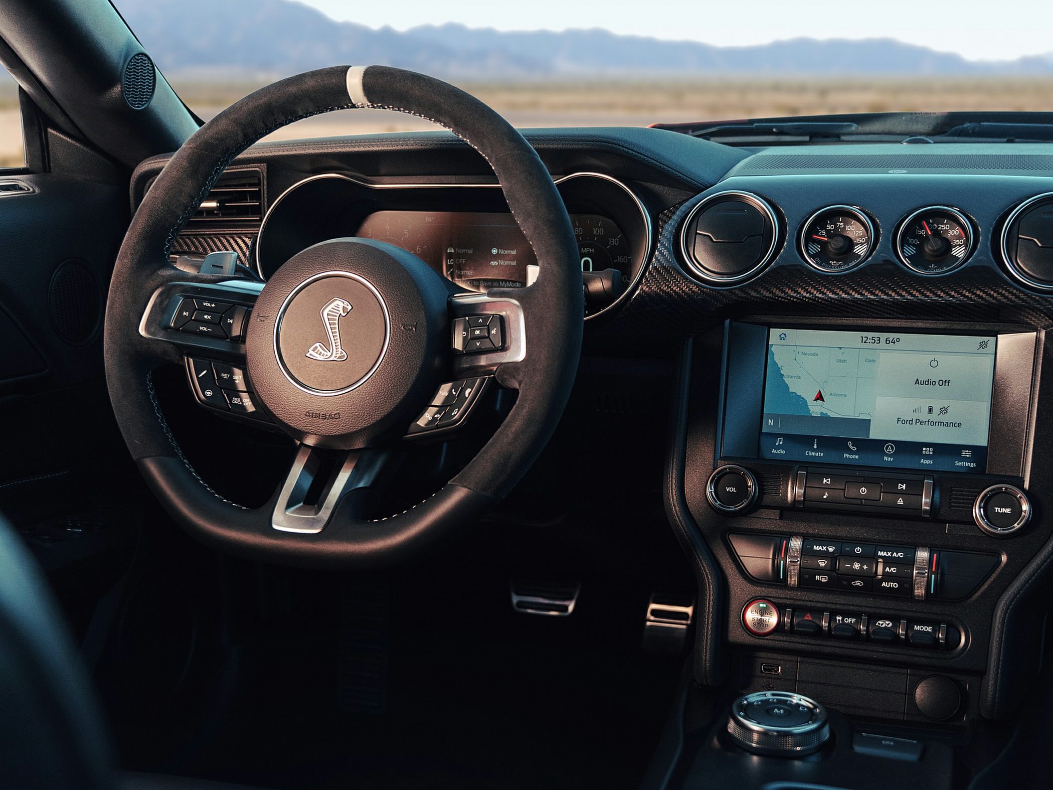 Steering wheel with Shelby emblem and infotainment dashboard