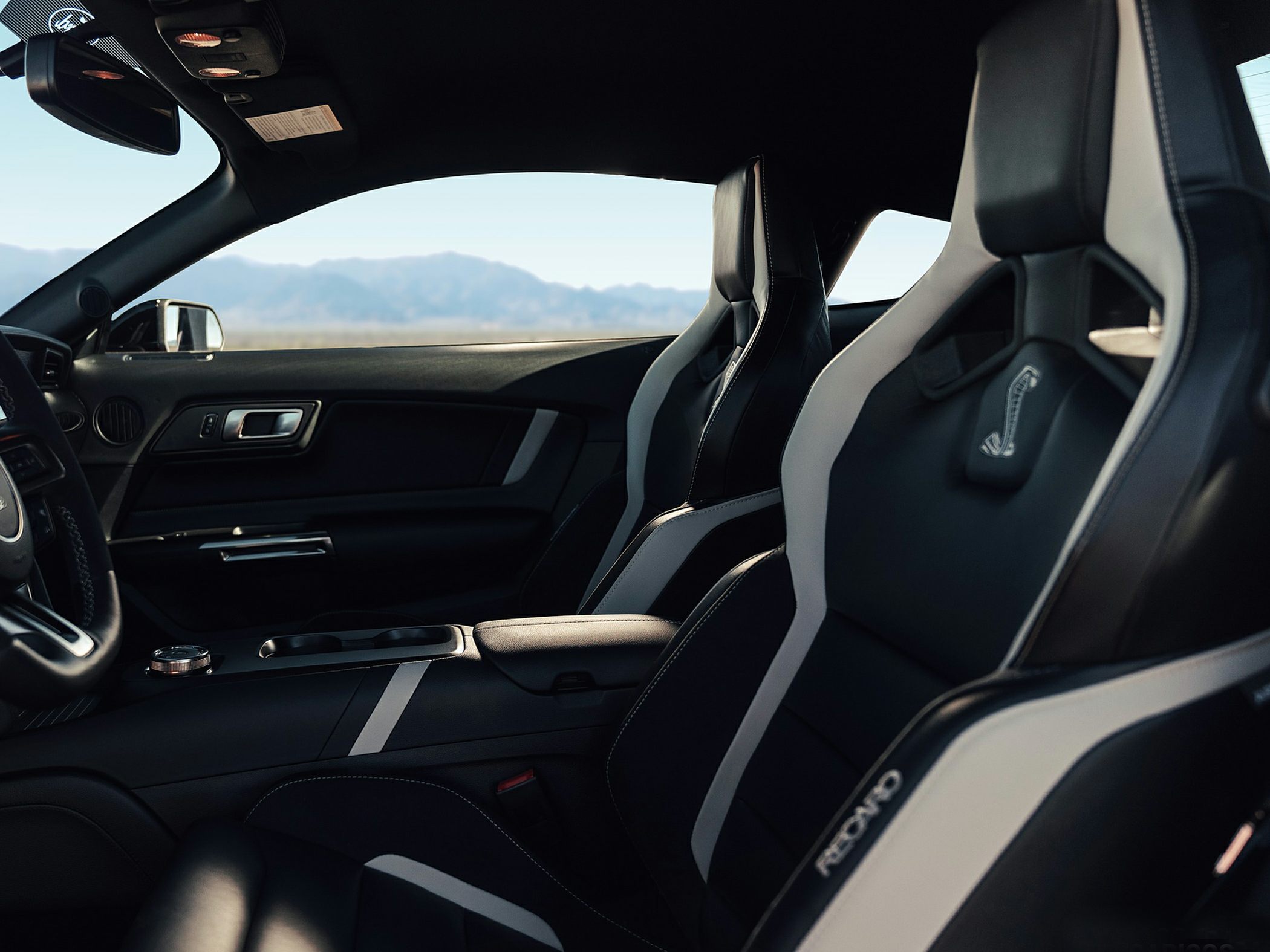 Black and white Recaro sports seats with Shelby logo and interior dashboard