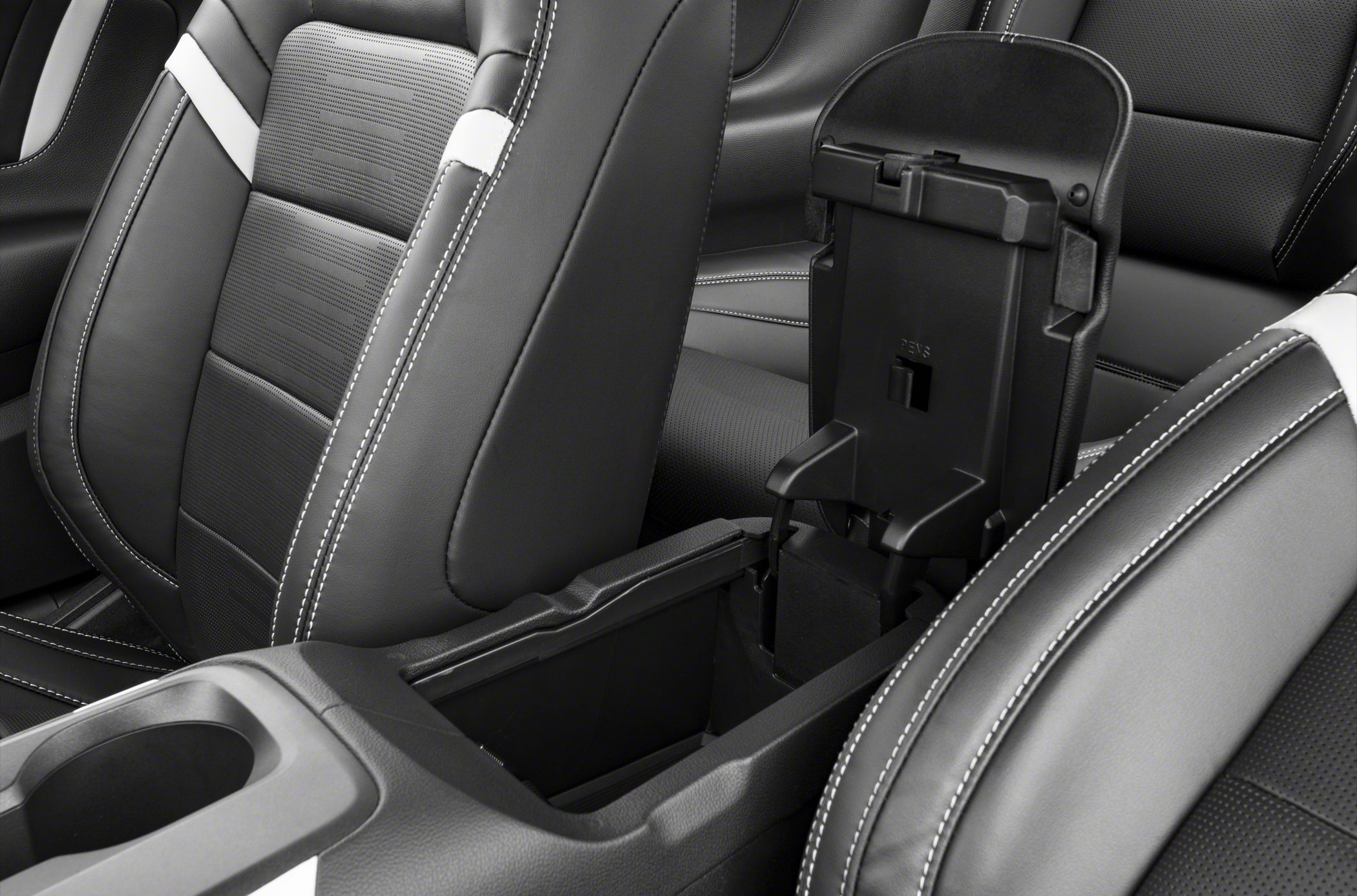 Leather seats with detailed stitching and open center console storage