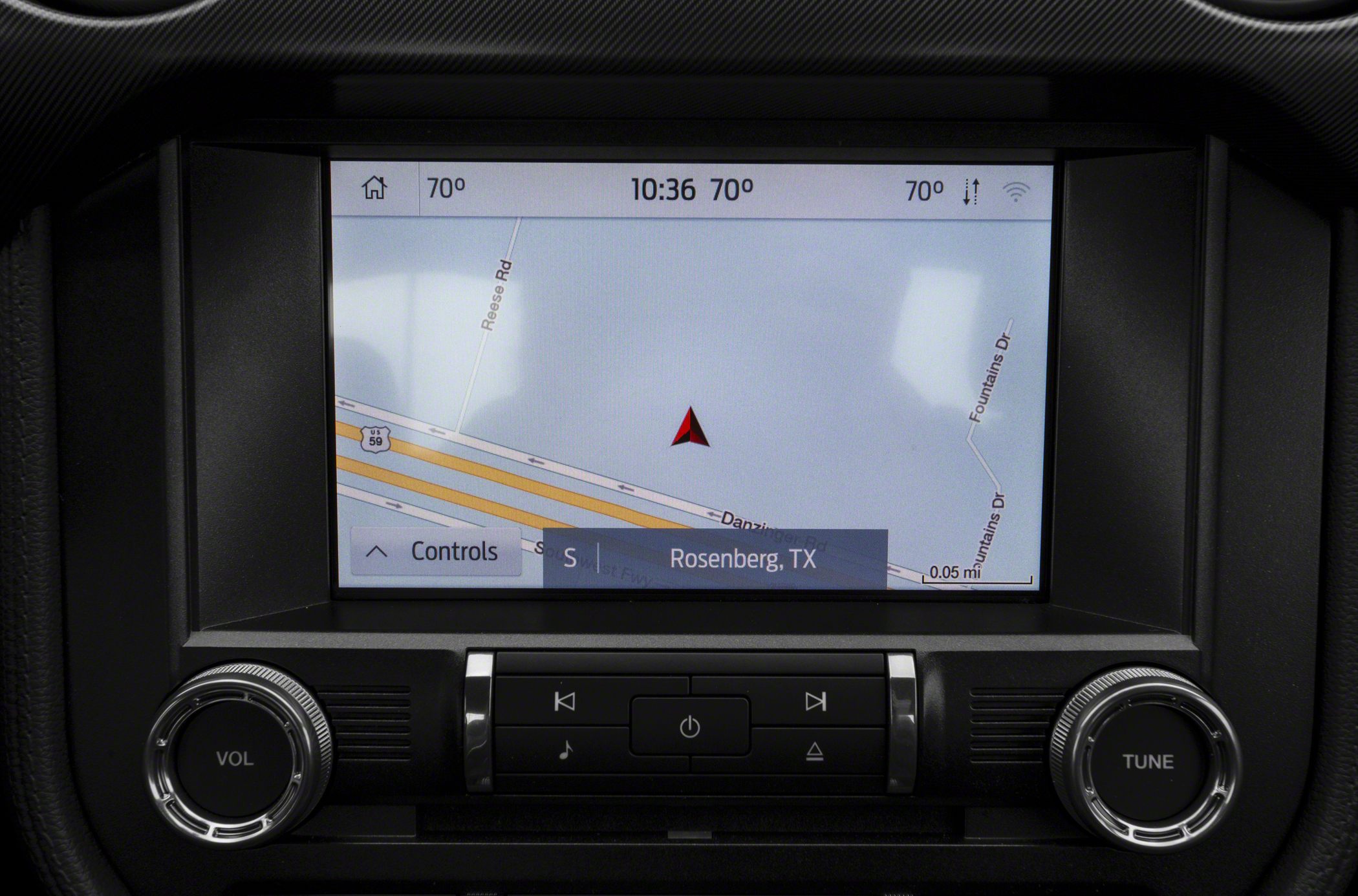 Navigation screen and audio control panel with volume and tuning knobs