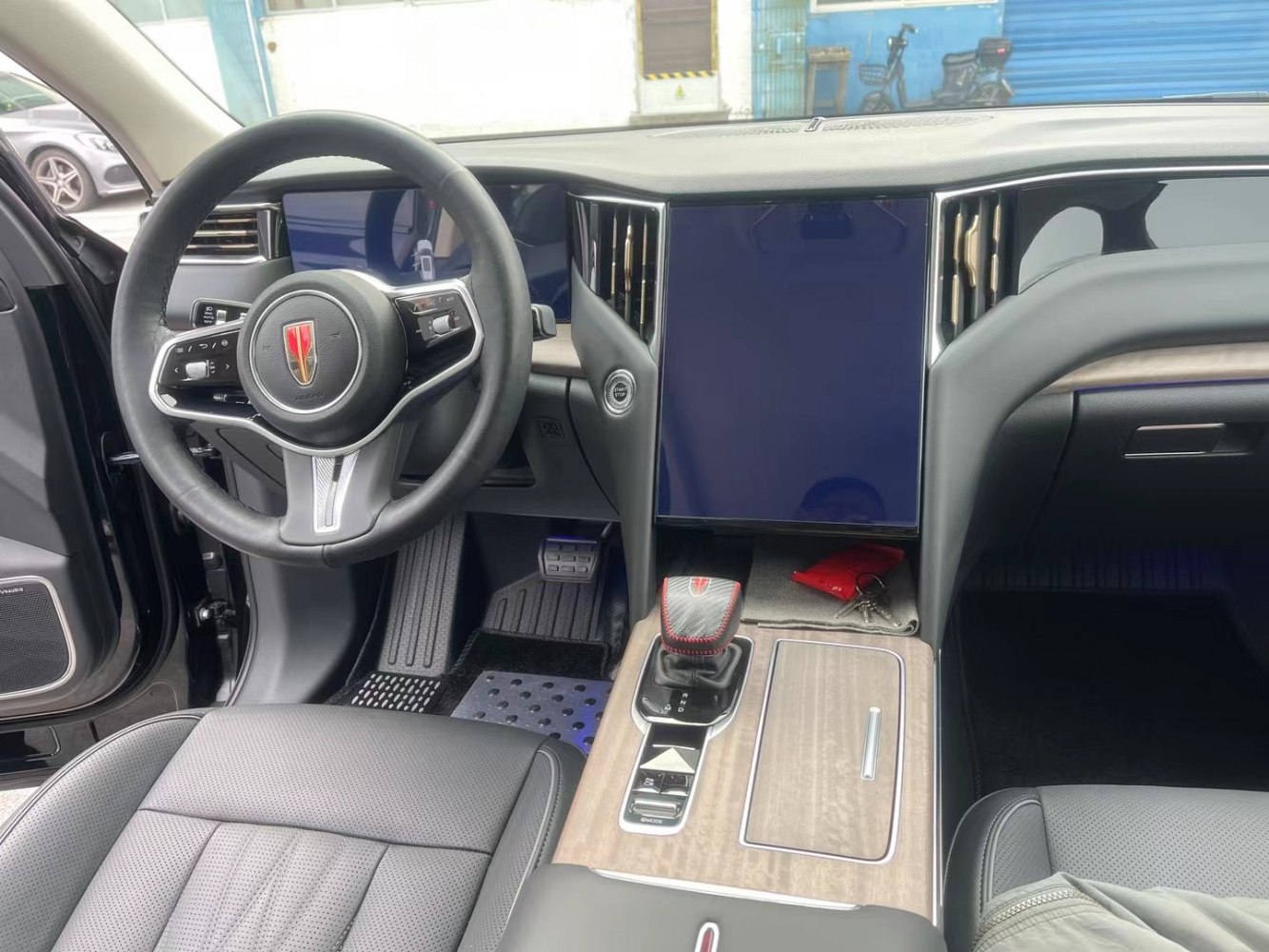Digital instrument cluster and large vertical touchscreen display.