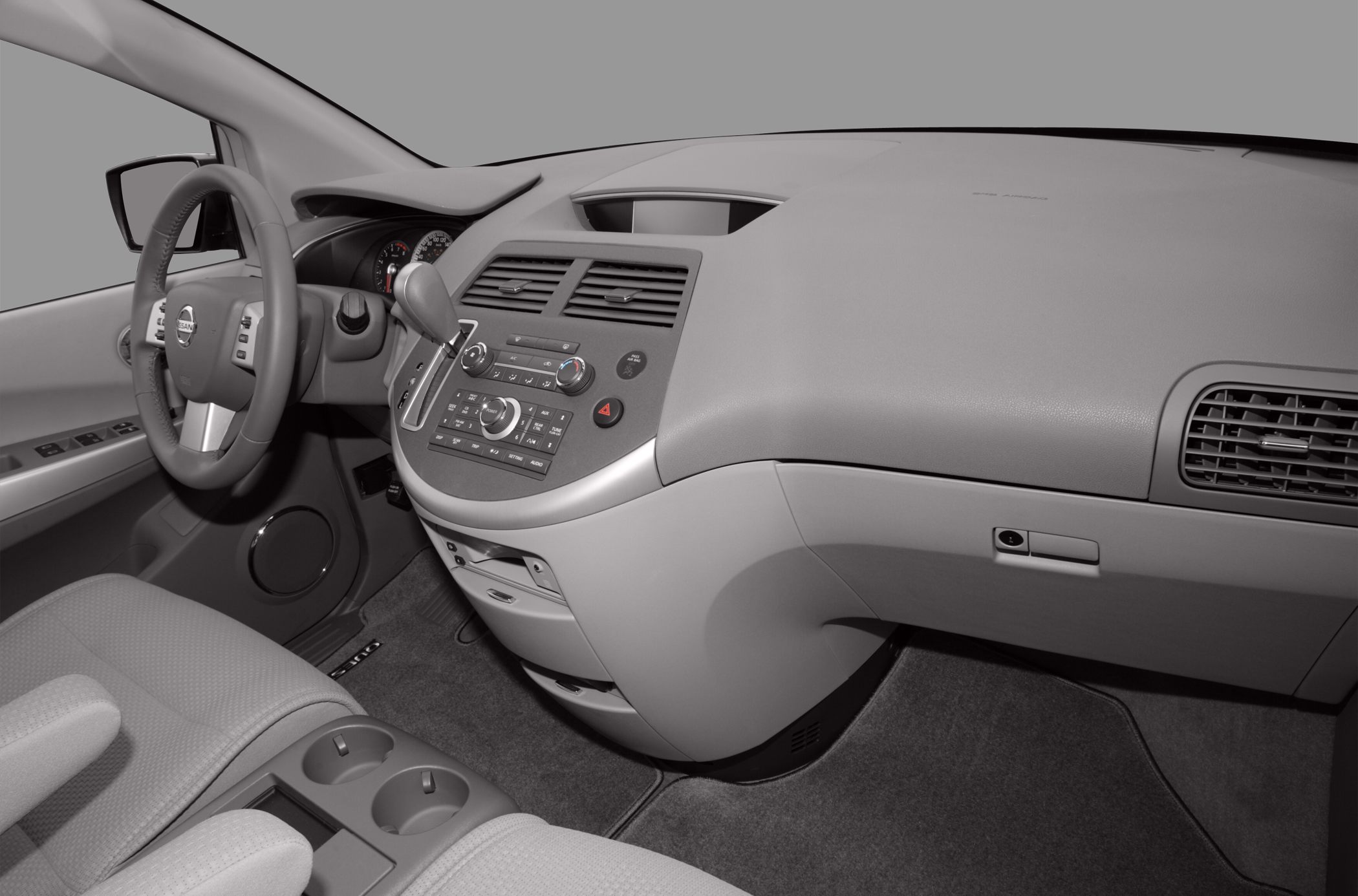 Dashboard and steering wheel with center console and gear shifter