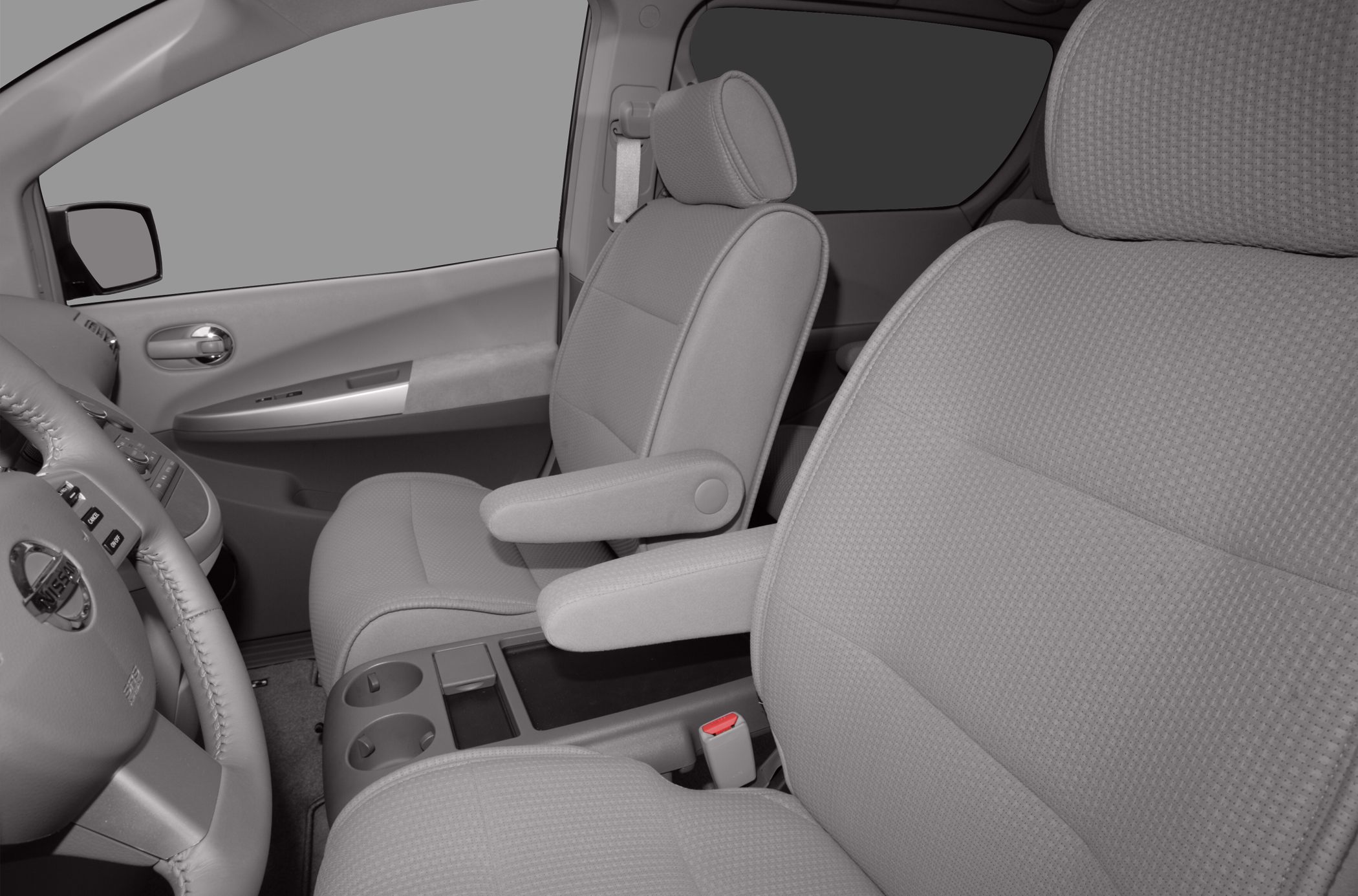 Front seats with armrests and center console inside vehicle
