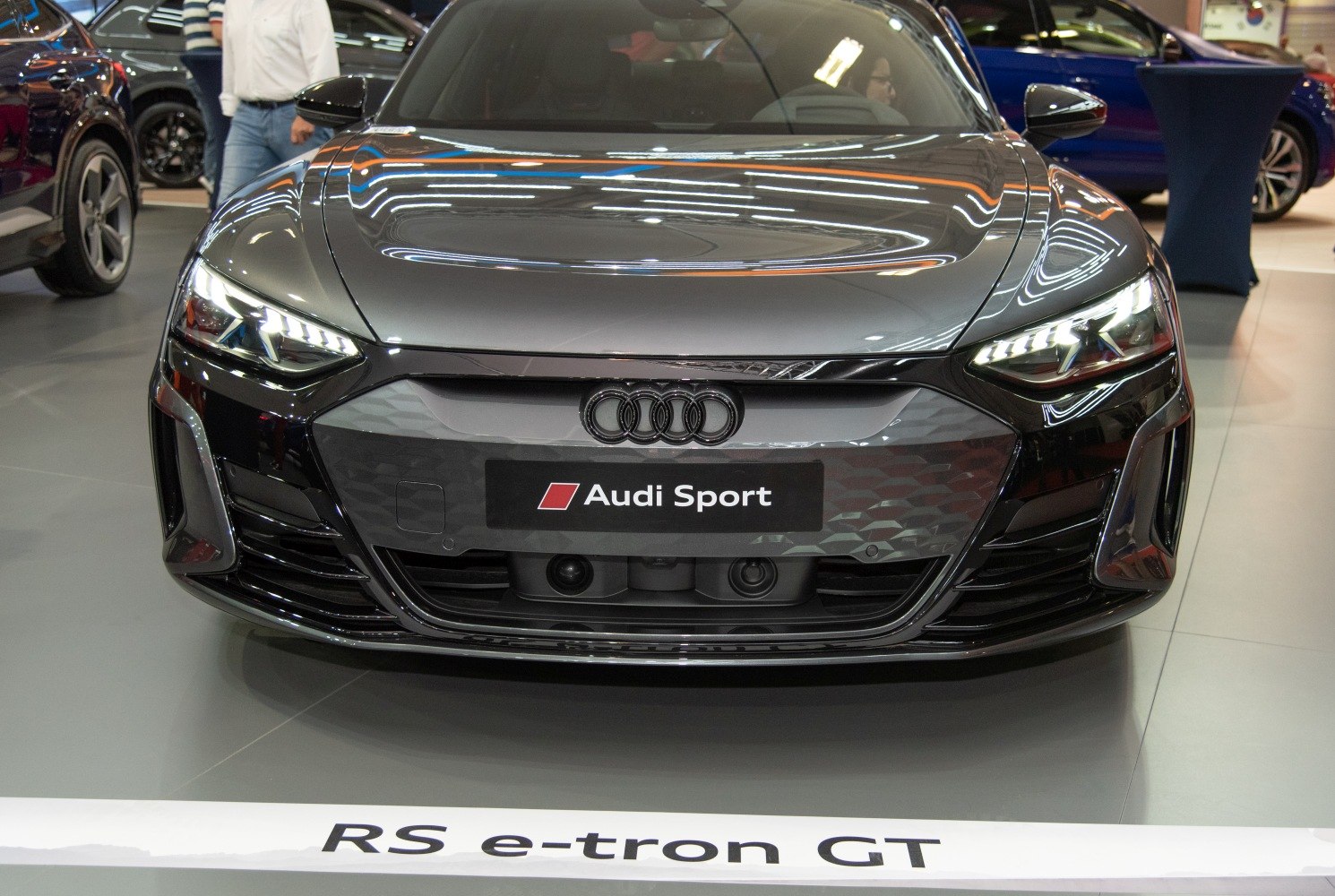 Front view of Audi RS e-tron GT with LED headlights and aggressive grille