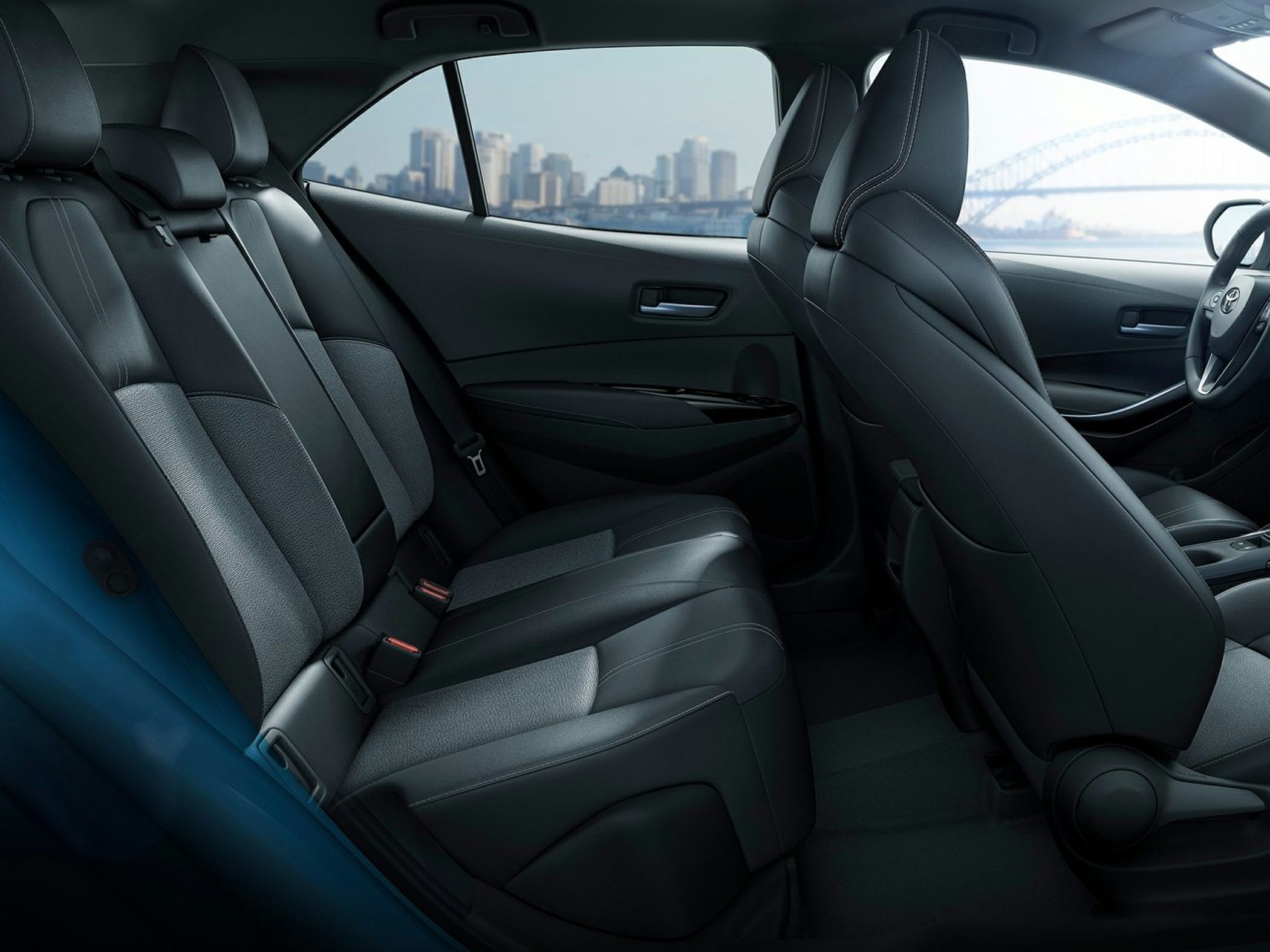 Rear seating interior with black upholstery and spacious layout