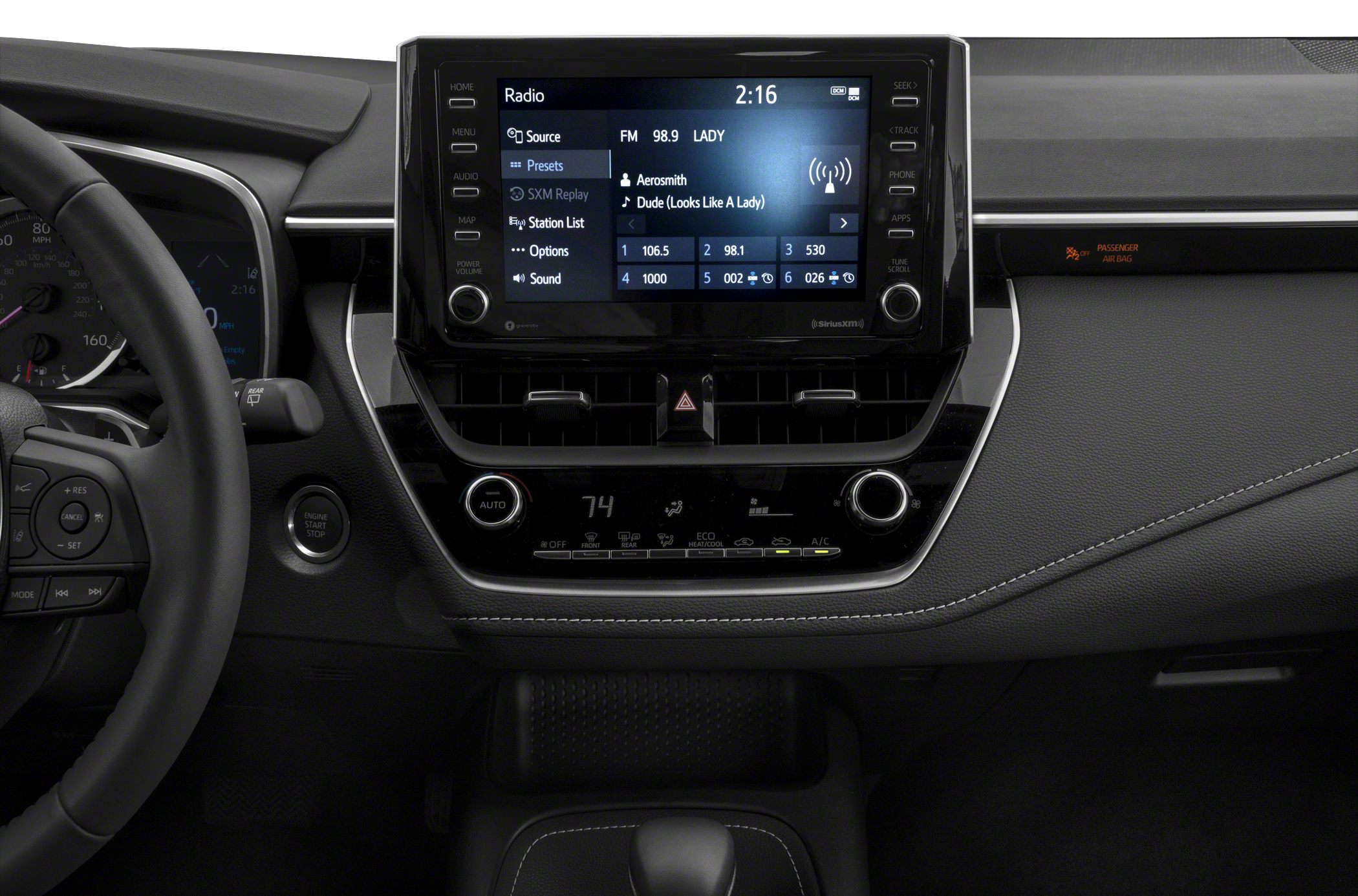 Infotainment touchscreen and climate control panel with steering wheel buttons.