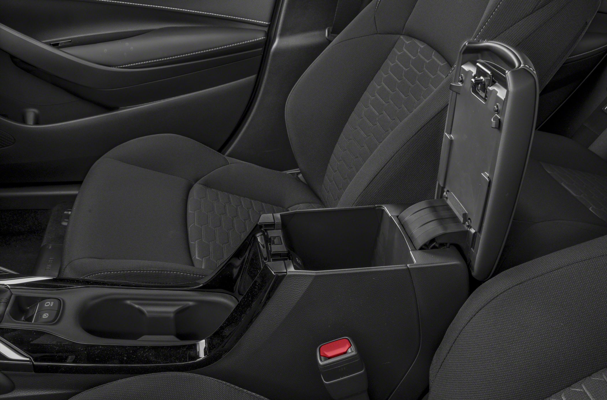 Center console storage compartment with front seats upholstery