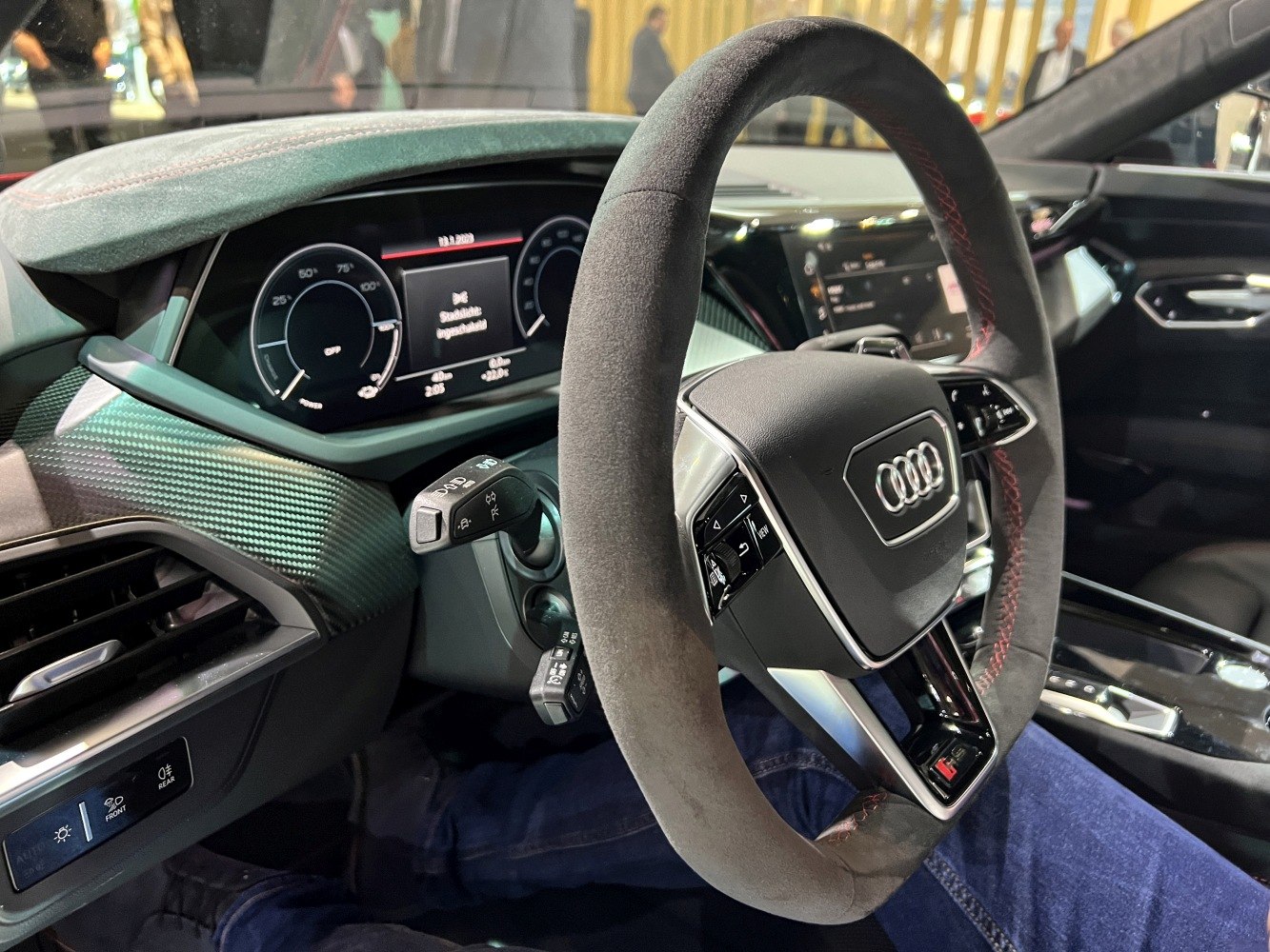 Digital instrument cluster and suede steering wheel with red stitching