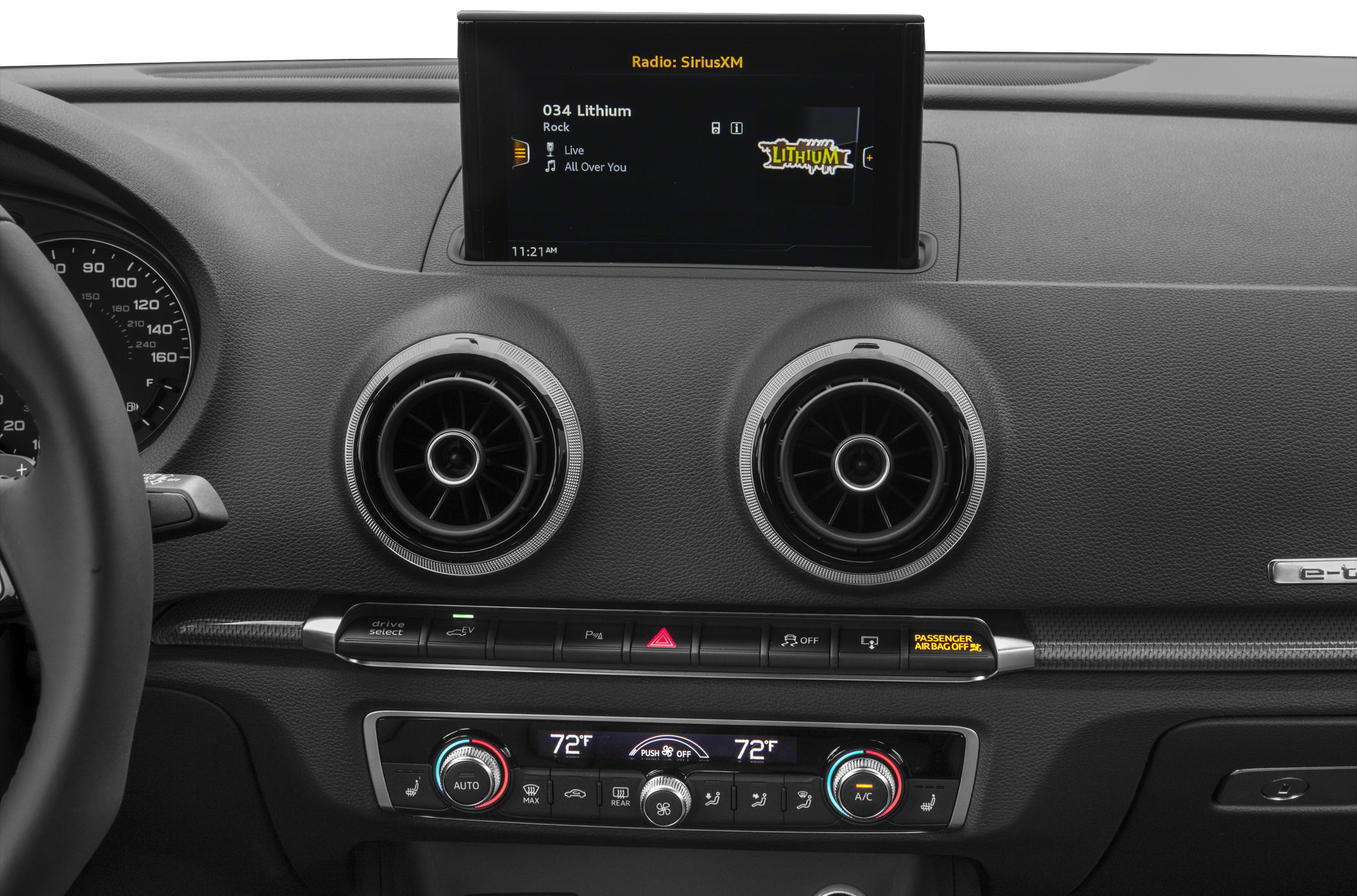 Round air vents and infotainment screen on dashboard