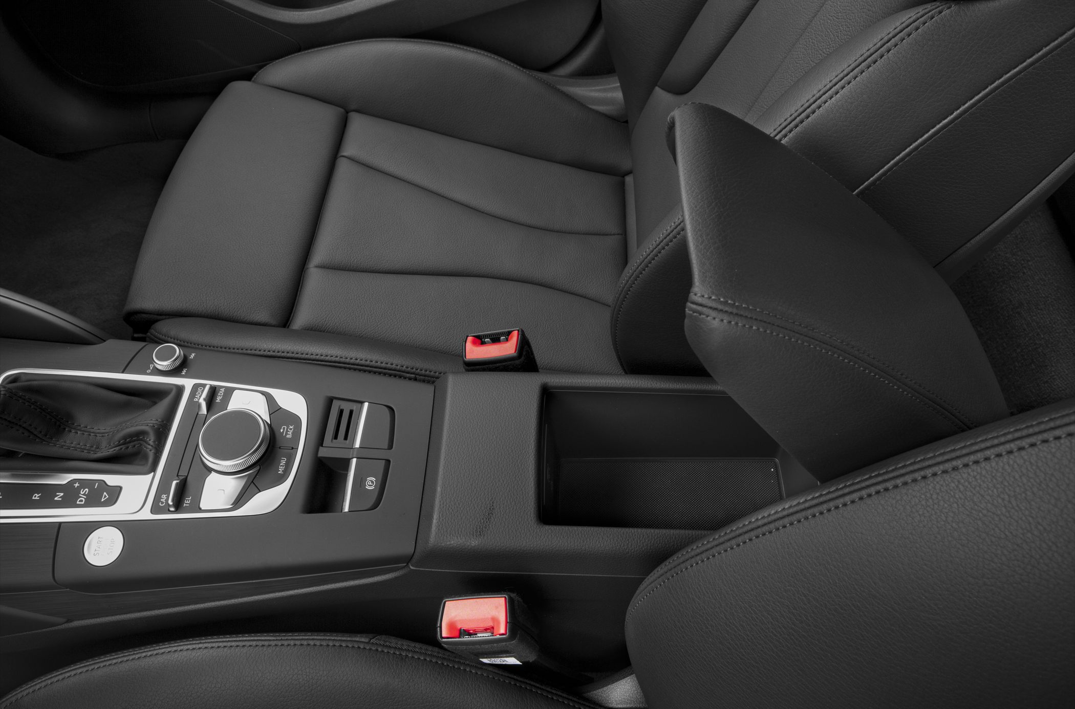Black leather seat and central console with gear selector and control dial