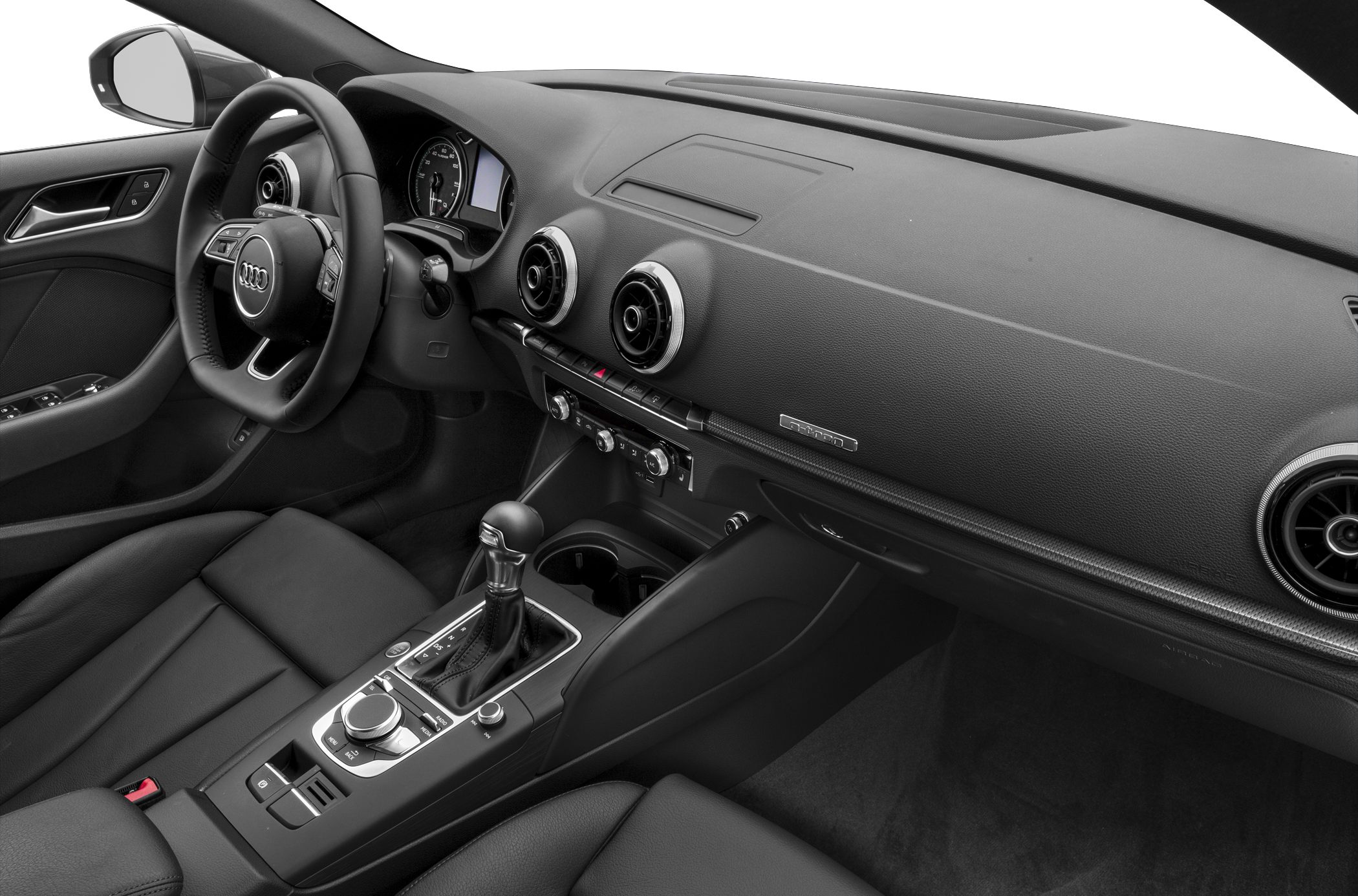 Modern car interior with dashboard, circular vents, steering wheel, and center console.