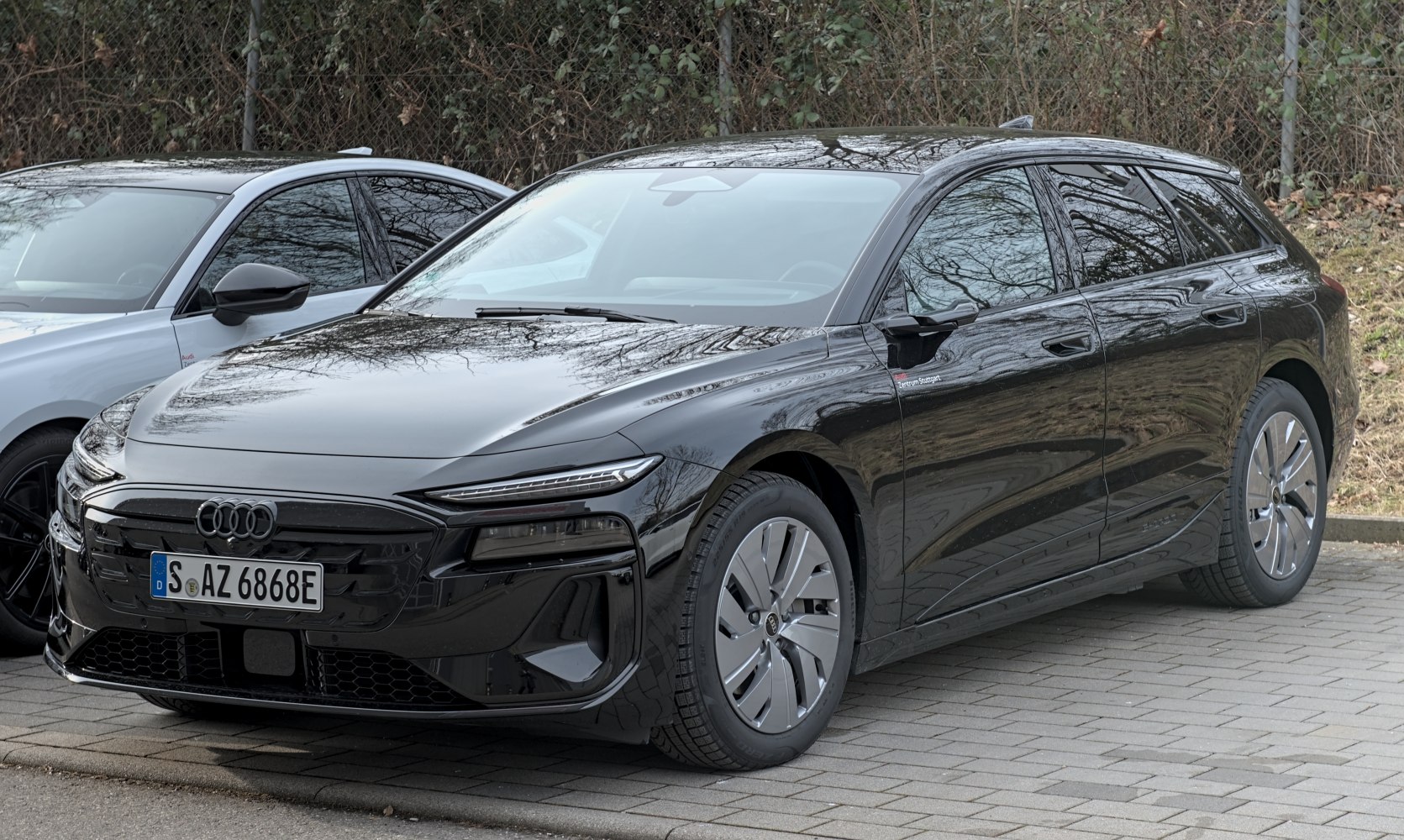 Black electric wagon with aerodynamic body and LED matrix headlights