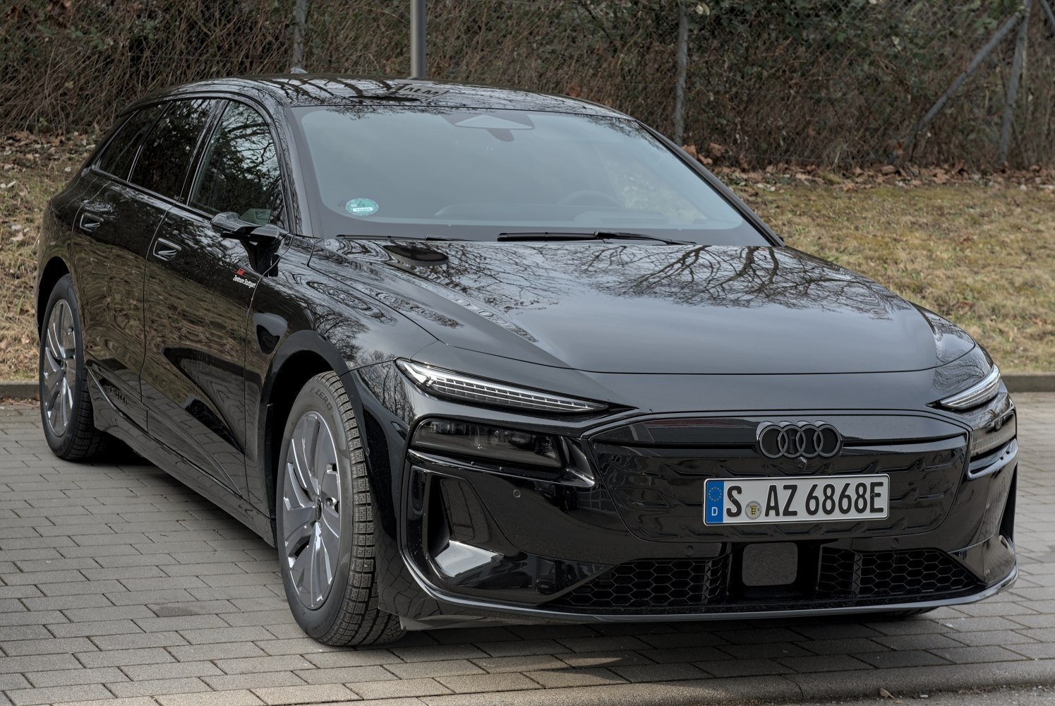 Sporty electric station wagon front with sleek LED headlights and aerodynamic shape