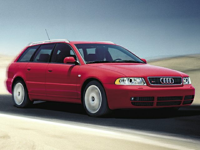 Red sporty station wagon with characteristic headlights and sleek body lines