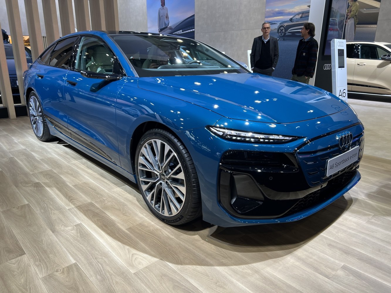 Sleek LED headlights and stylish alloy wheels on a modern electric sedan