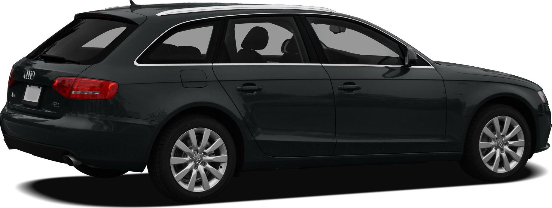 Side view of a black station wagon with alloy wheels and roof rails