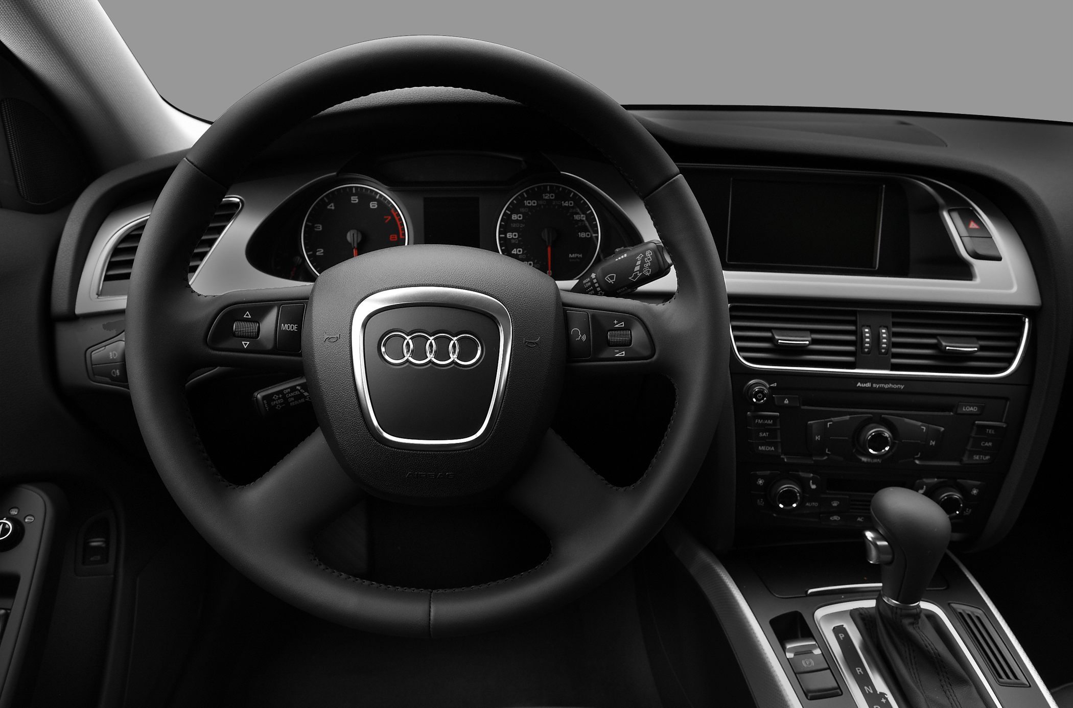 Audi steering wheel and dashboard with instrument cluster and controls