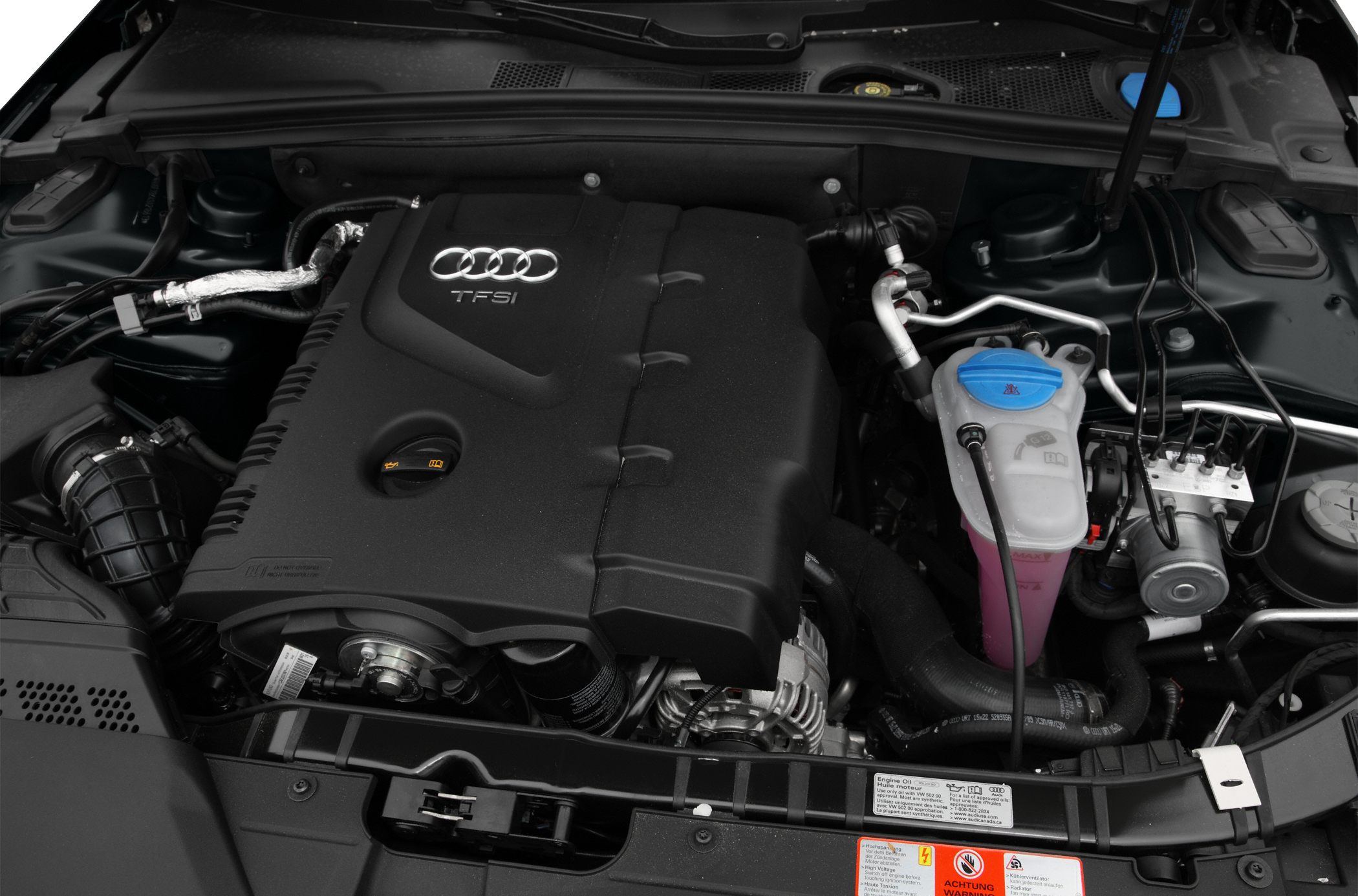 Close-up of TFSI engine with visible components and coolant reservoir.