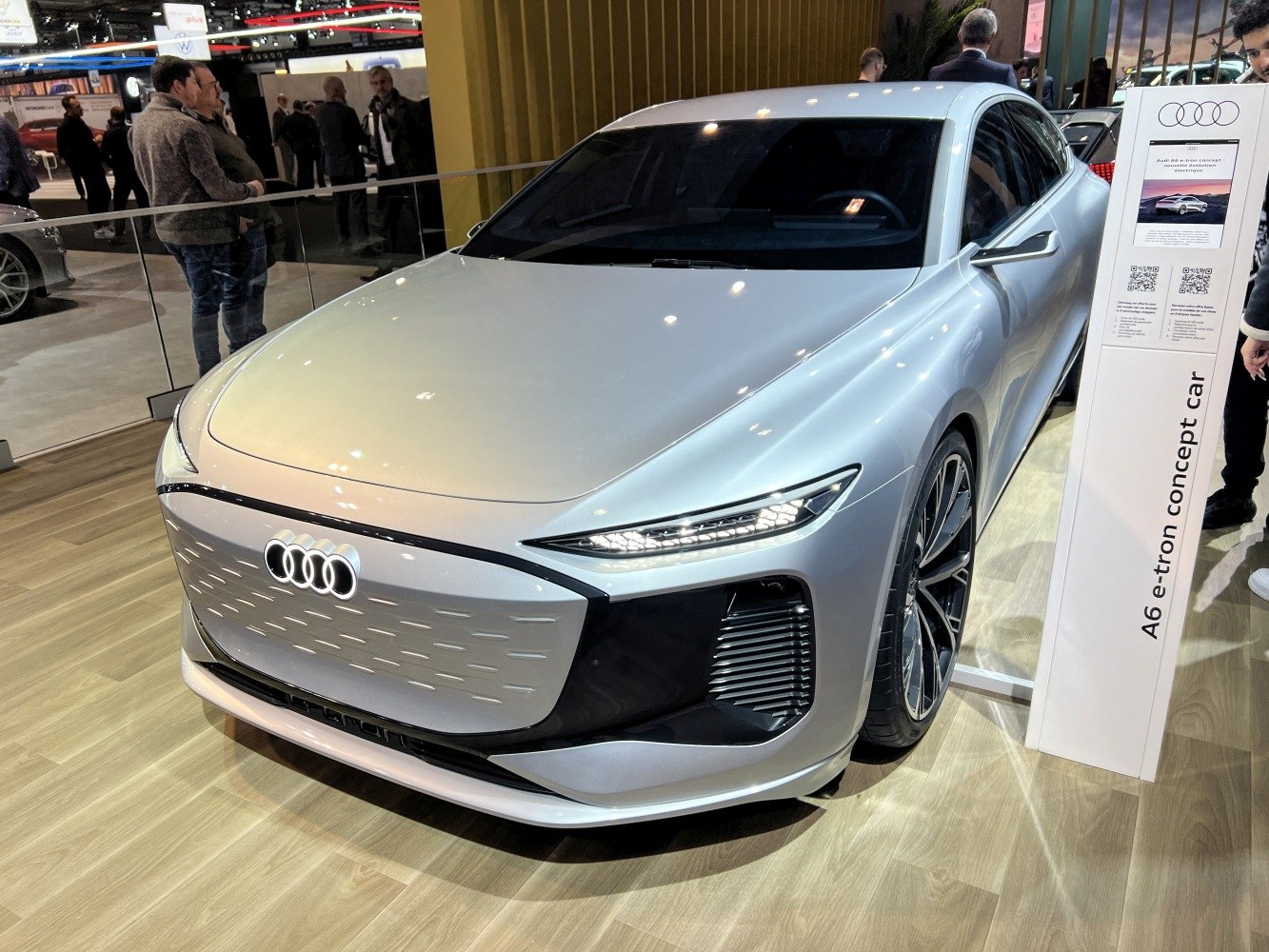 Sleek front fascia with illuminated Audi rings and aerodynamic side profile.