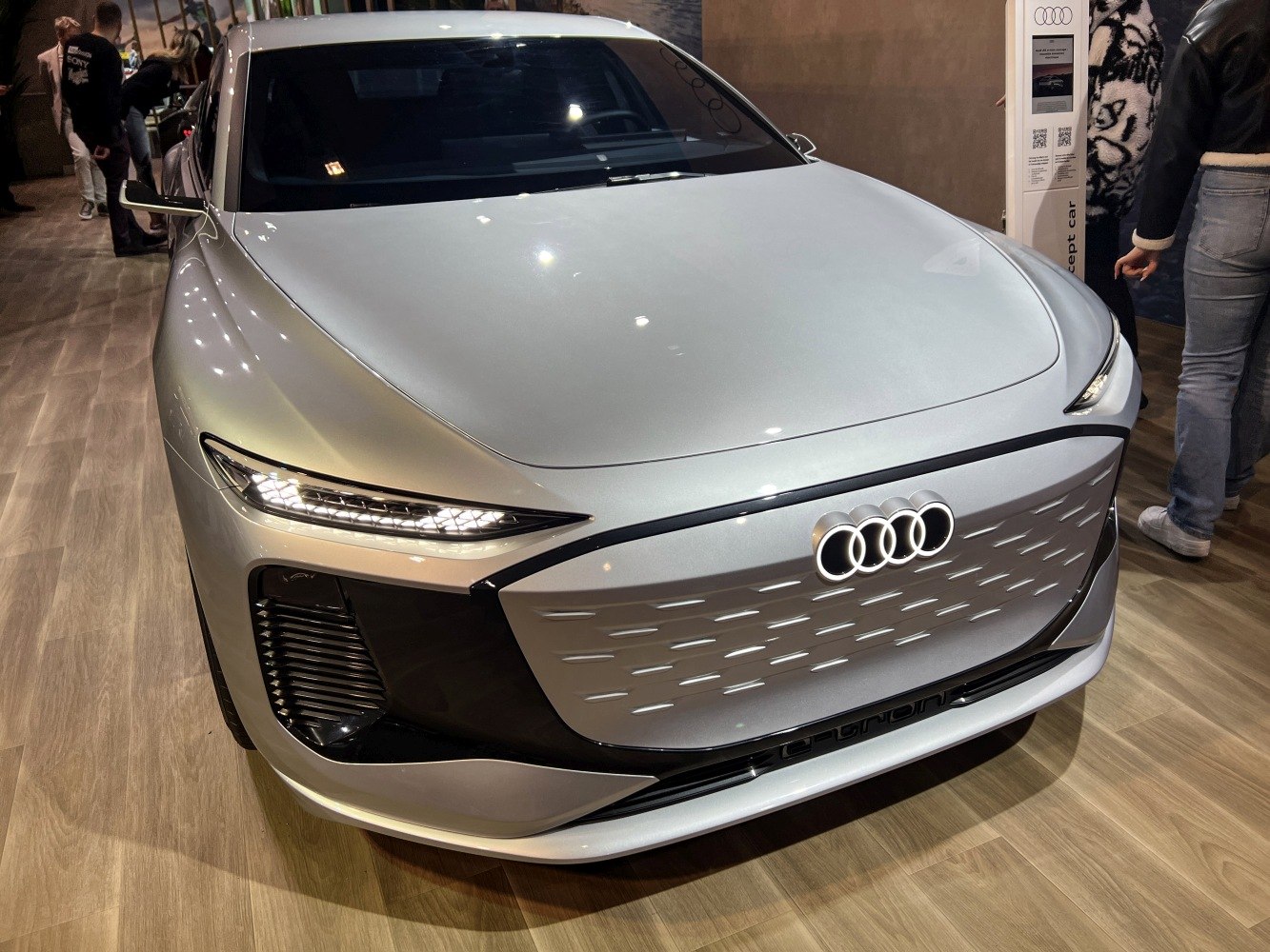 Sleek front view with illuminated Audi rings and sharp LED headlights