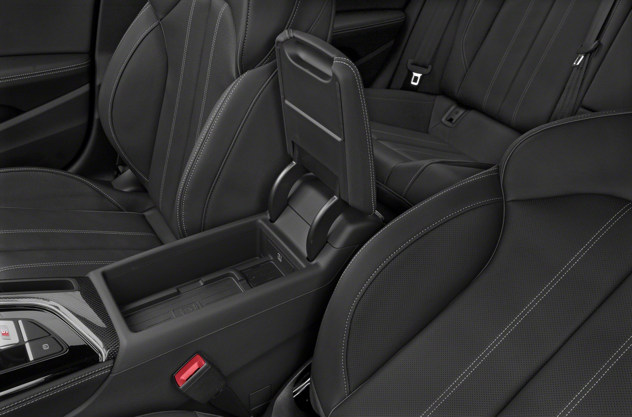 Premium sport seats with detailed stitching and a center console storage compartment.