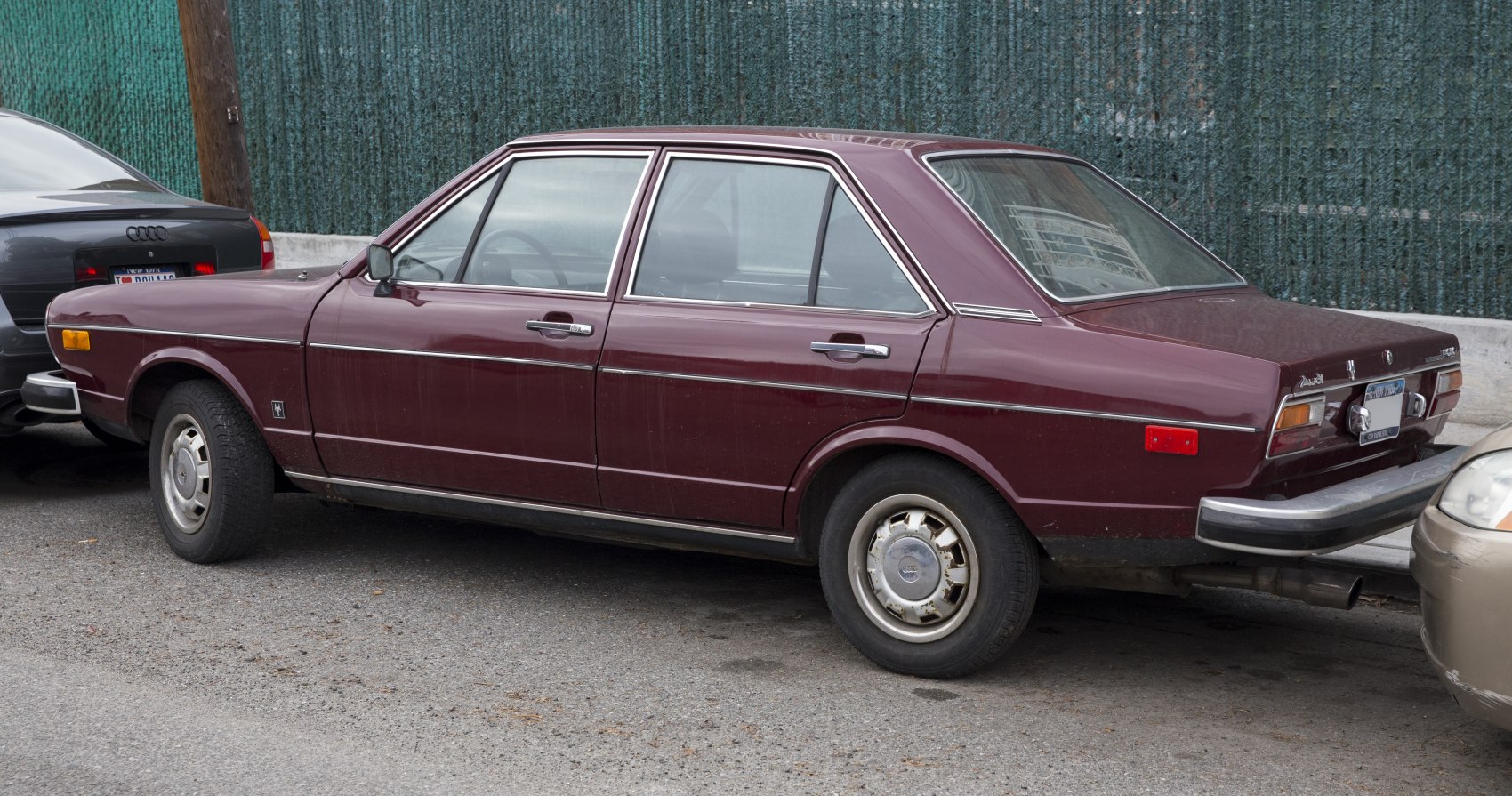 Vintage 1970s four-door sedan with chrome trim and classic hubcaps.