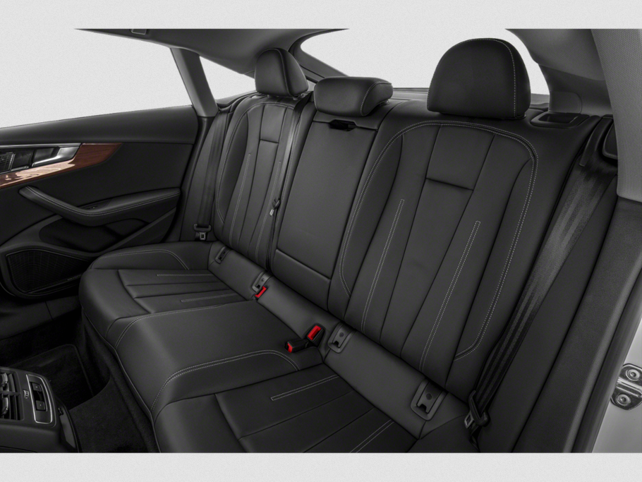 Black leather rear seats with detailed stitching and headrests