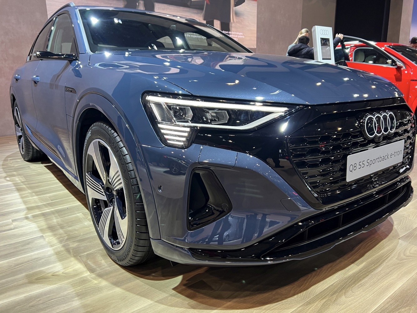 Close-up of vehicle front with LED headlights and modern grille