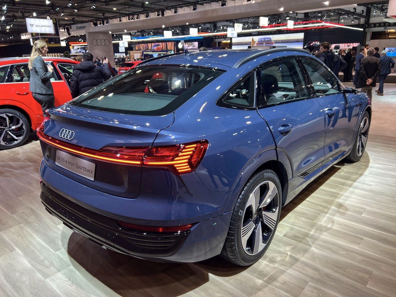 Electric luxury SUV rear with sportback shape and LED light bar