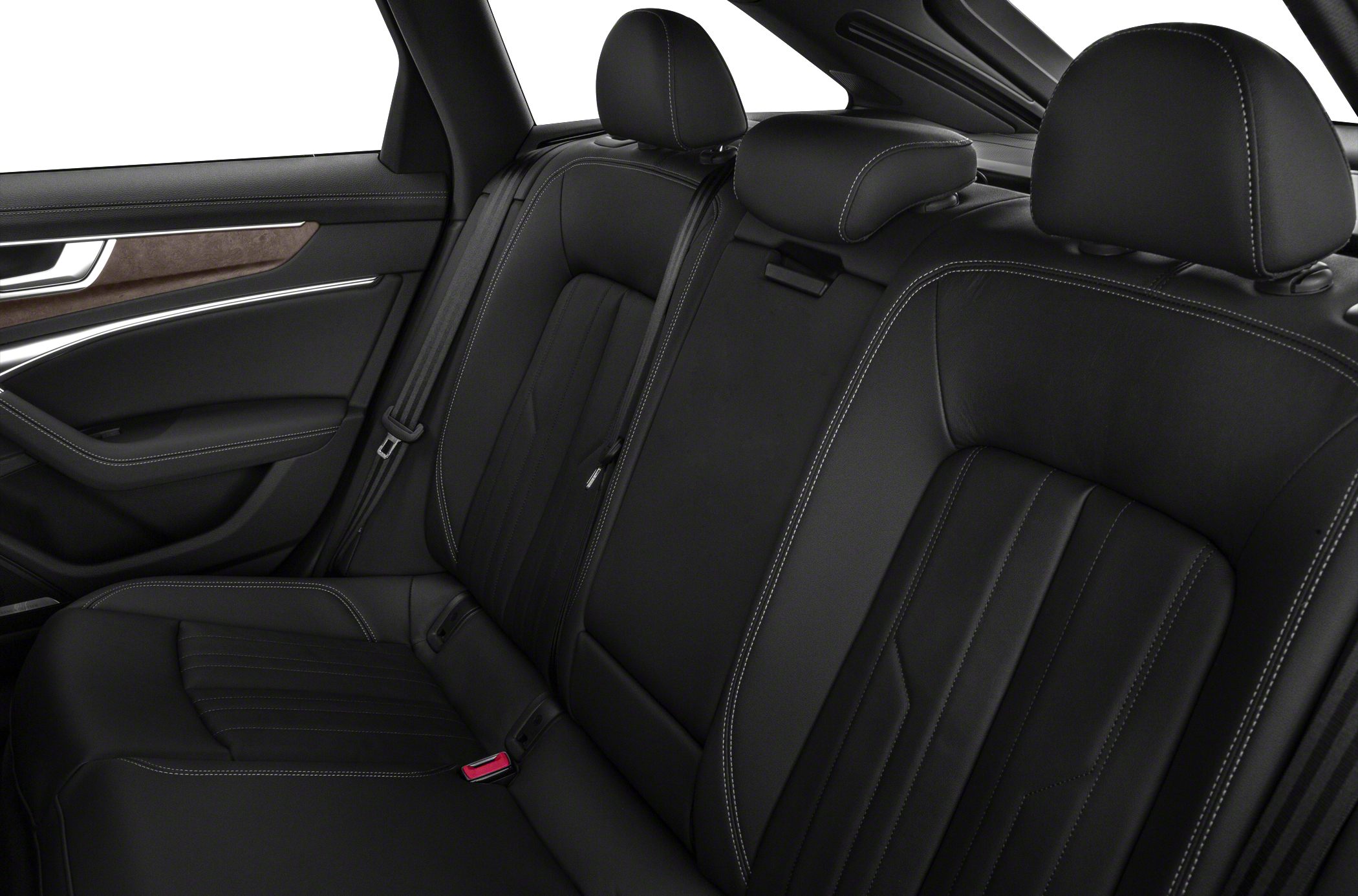 Black leather rear seats with white stitching and integrated headrests.